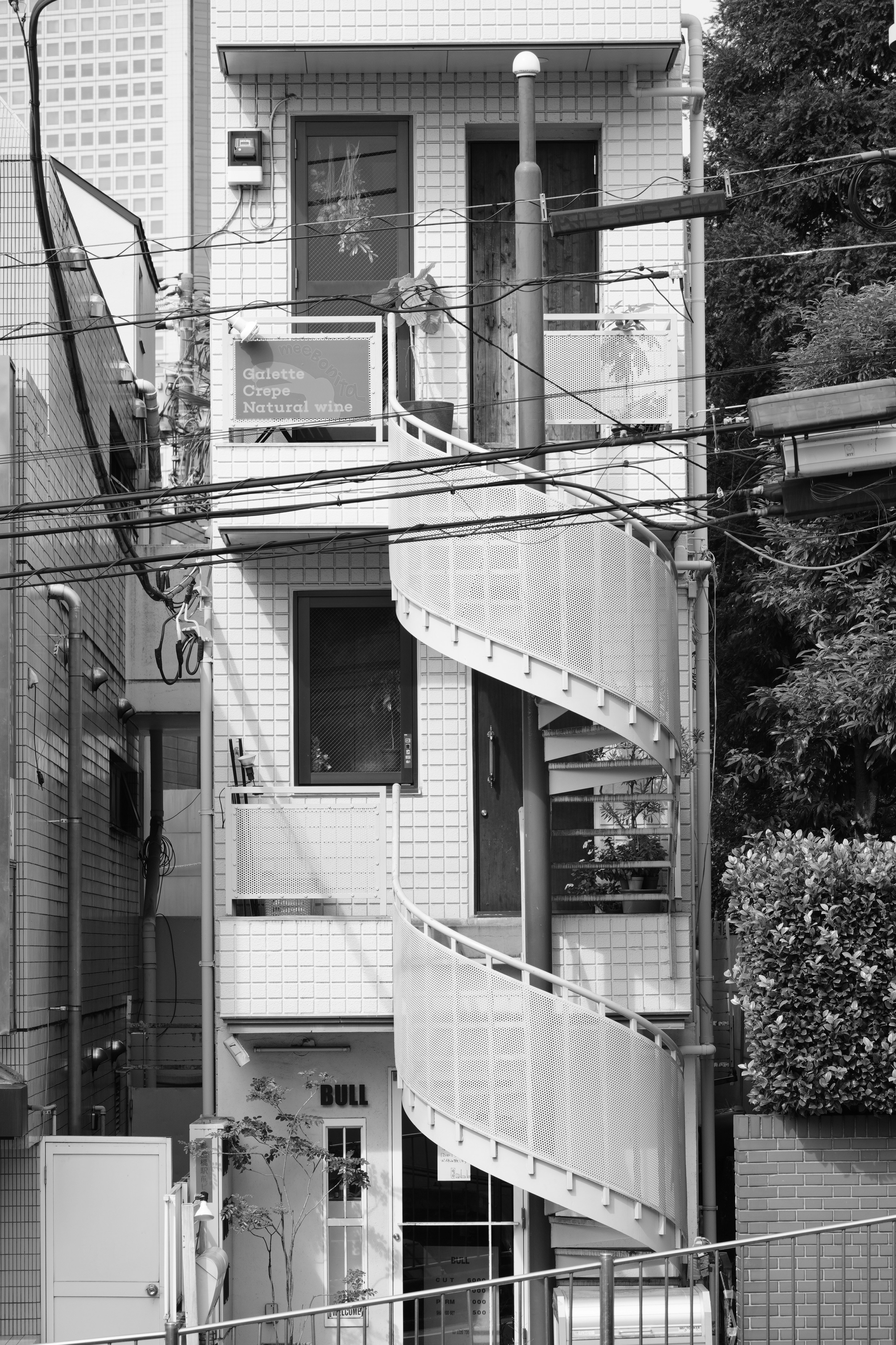 Narrow building with an external spiral staircase