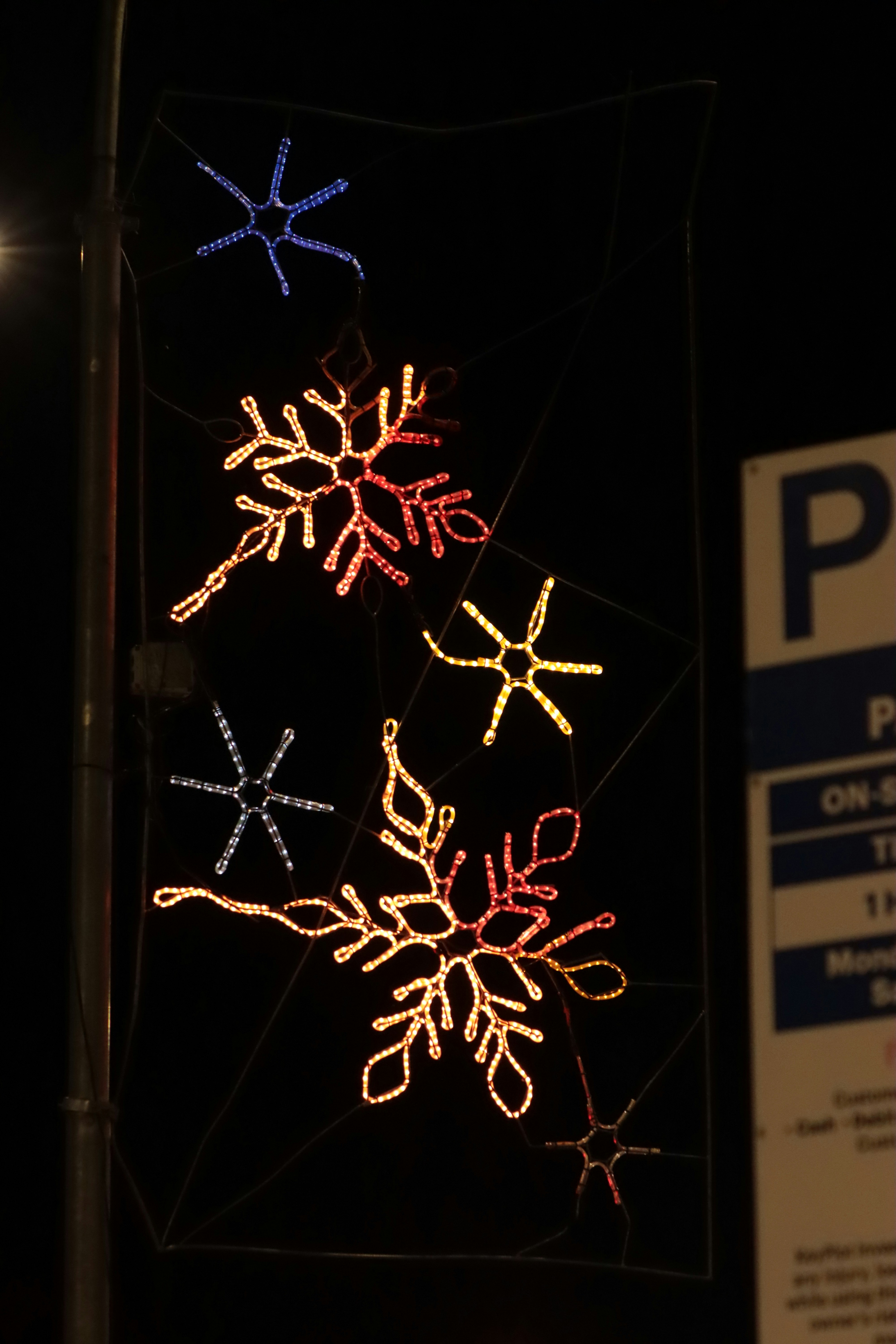 Decorative snowflake lights on a dark background