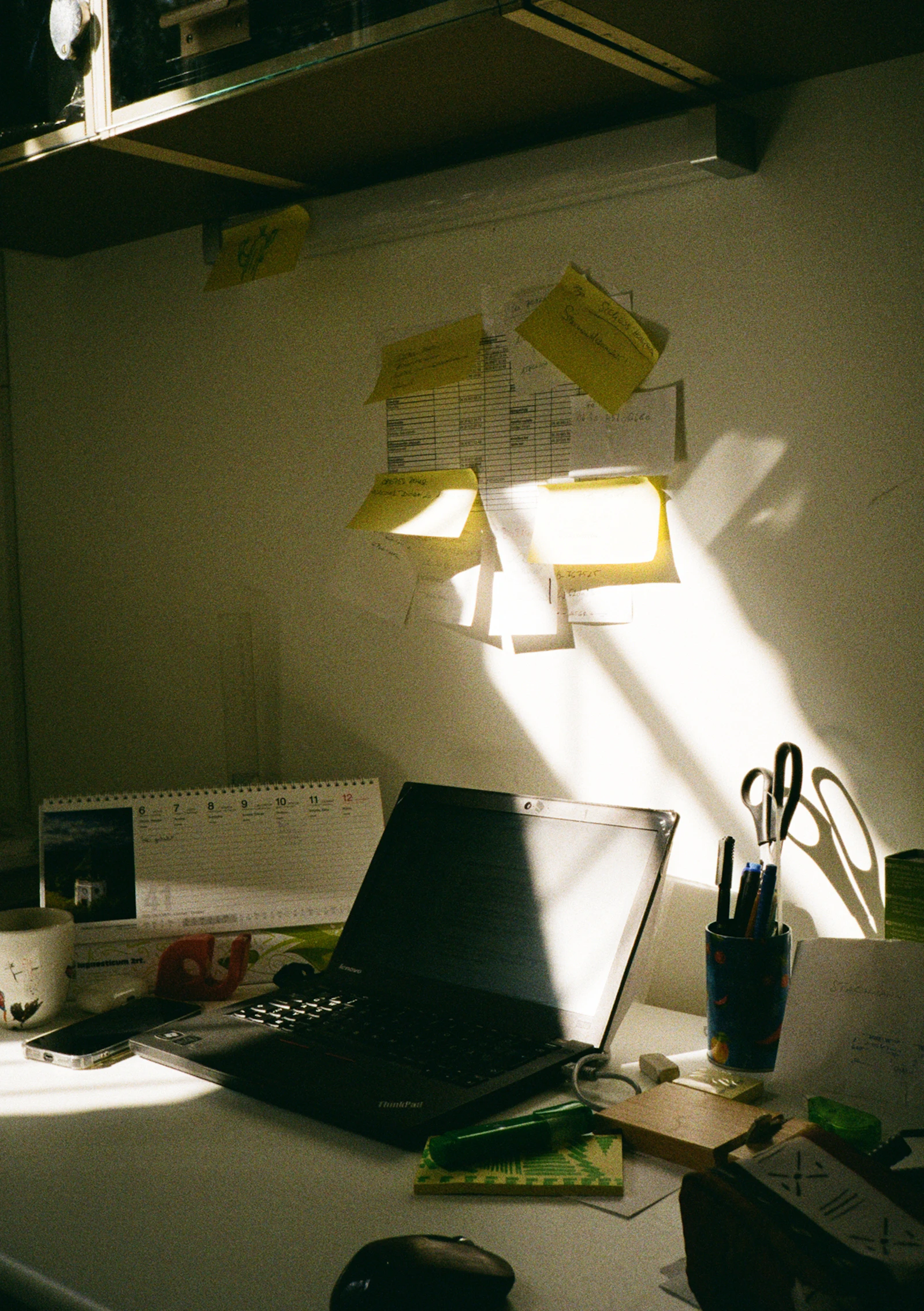 Laptop and planning notes used to map a digital product email launch