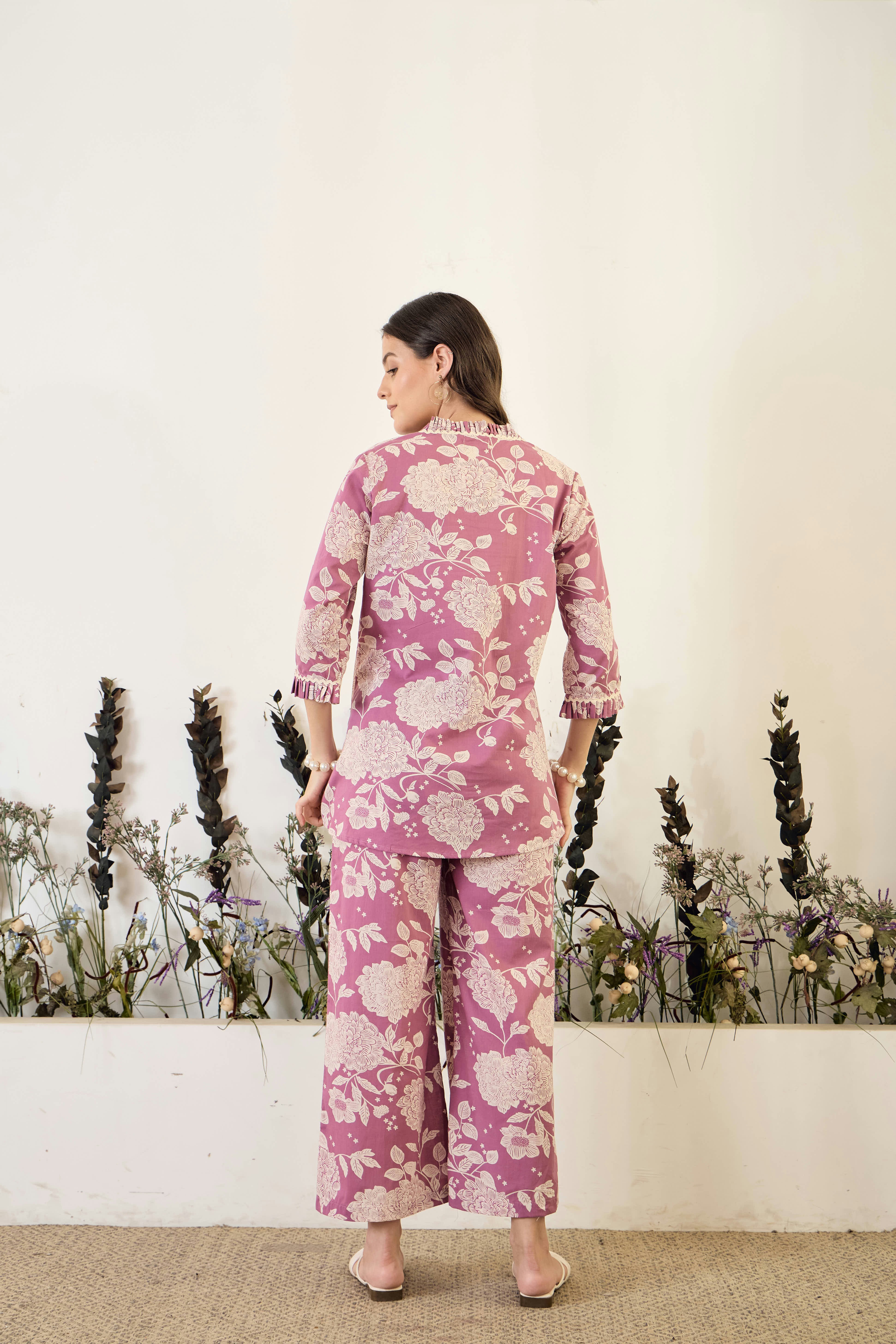 Woman wearing a floral print pajama set