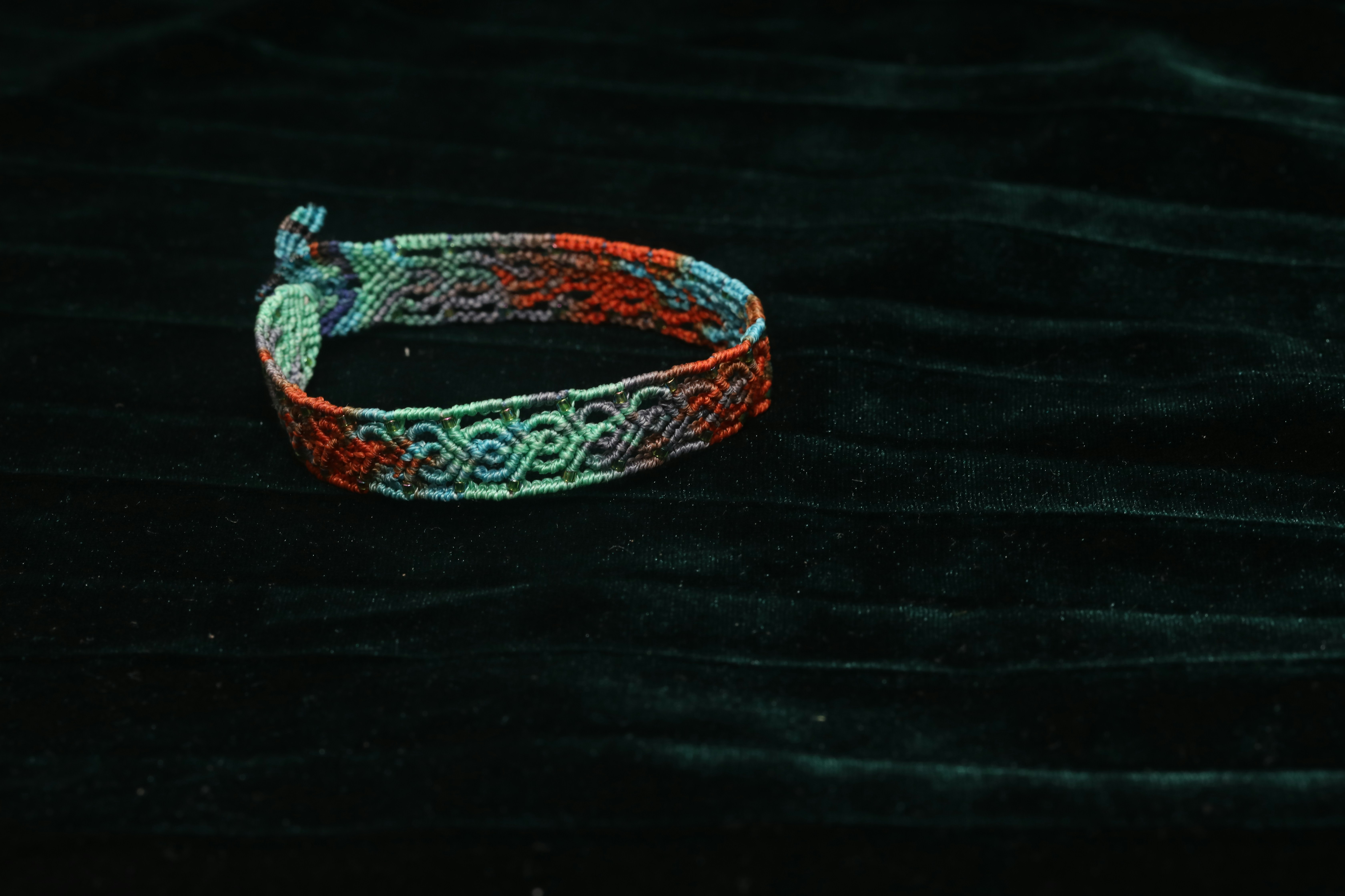 A close-up of an ancient bracelet with intricate patterns.