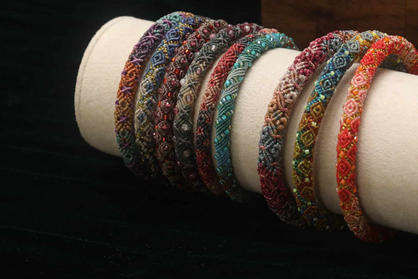 Close look at polished obsidian beads and warm metal accents