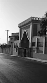 Street view of a building with ornate gate