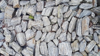 A wall made of grey and white stones