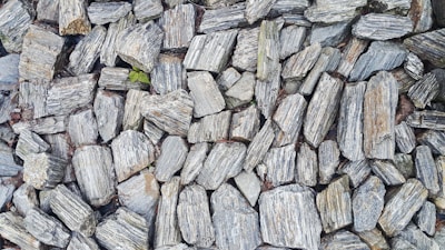 A wall made of grey and white stones