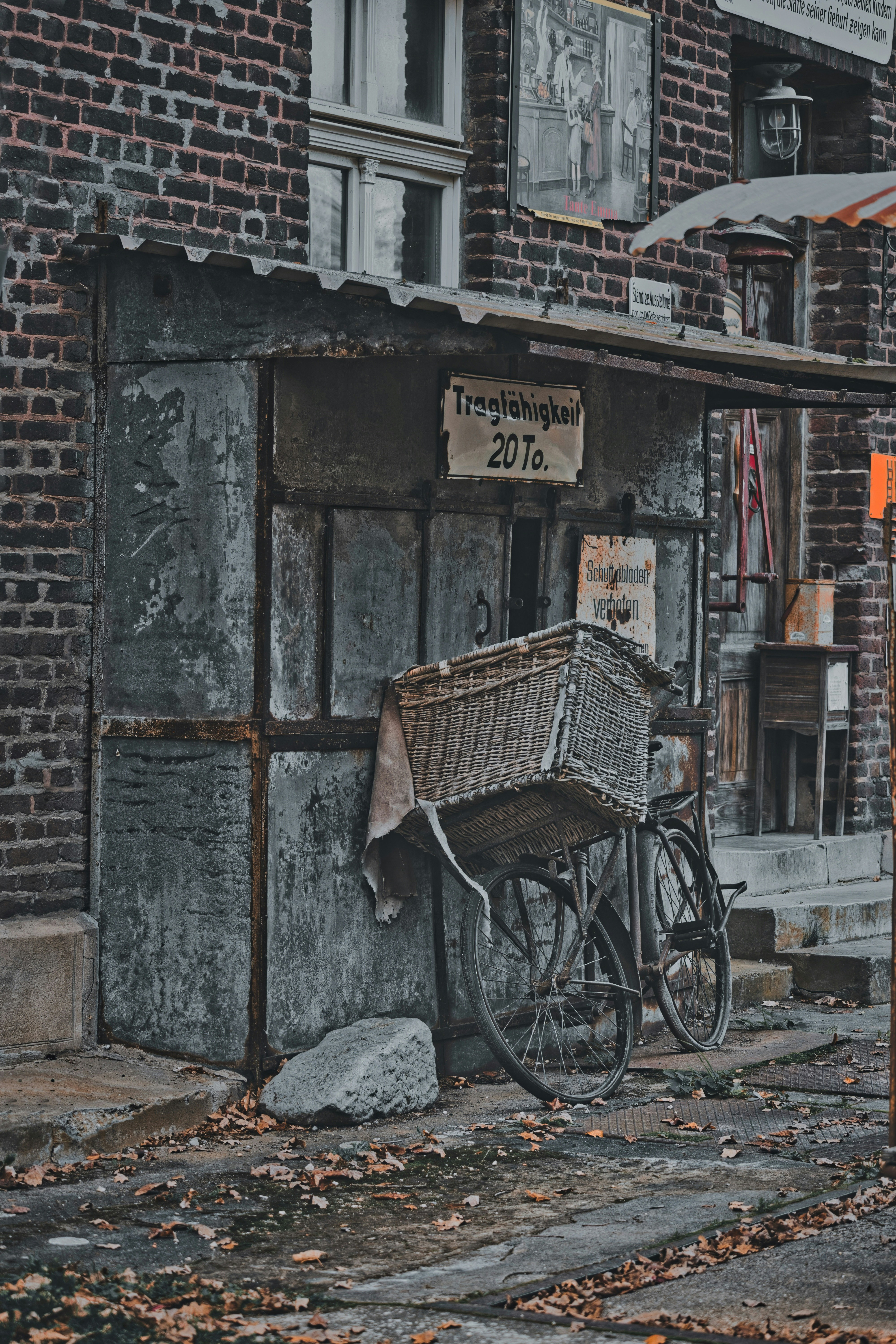 Vintage bicycle with basket outside old building.
