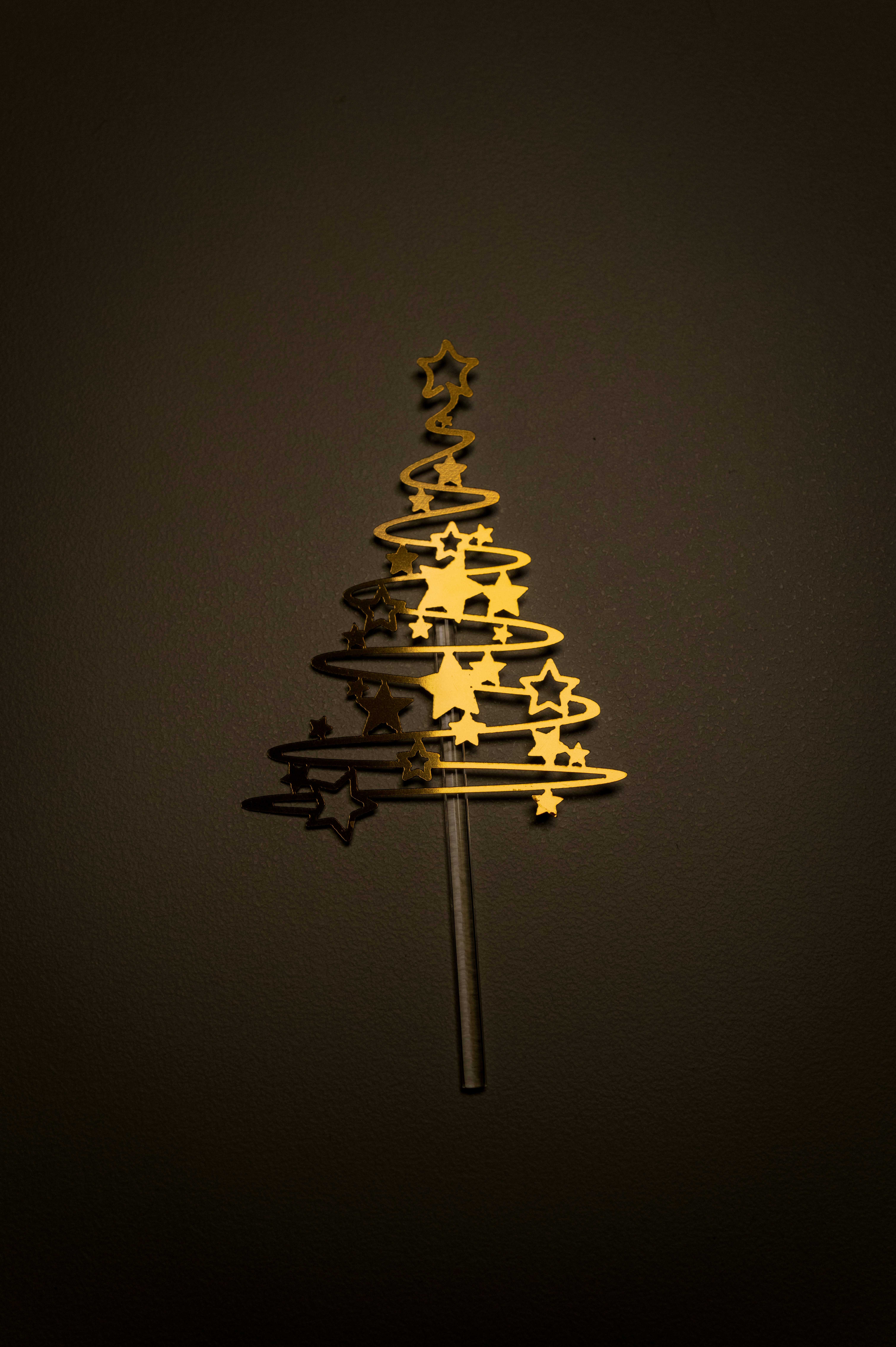 Golden christmas tree decoration with stars