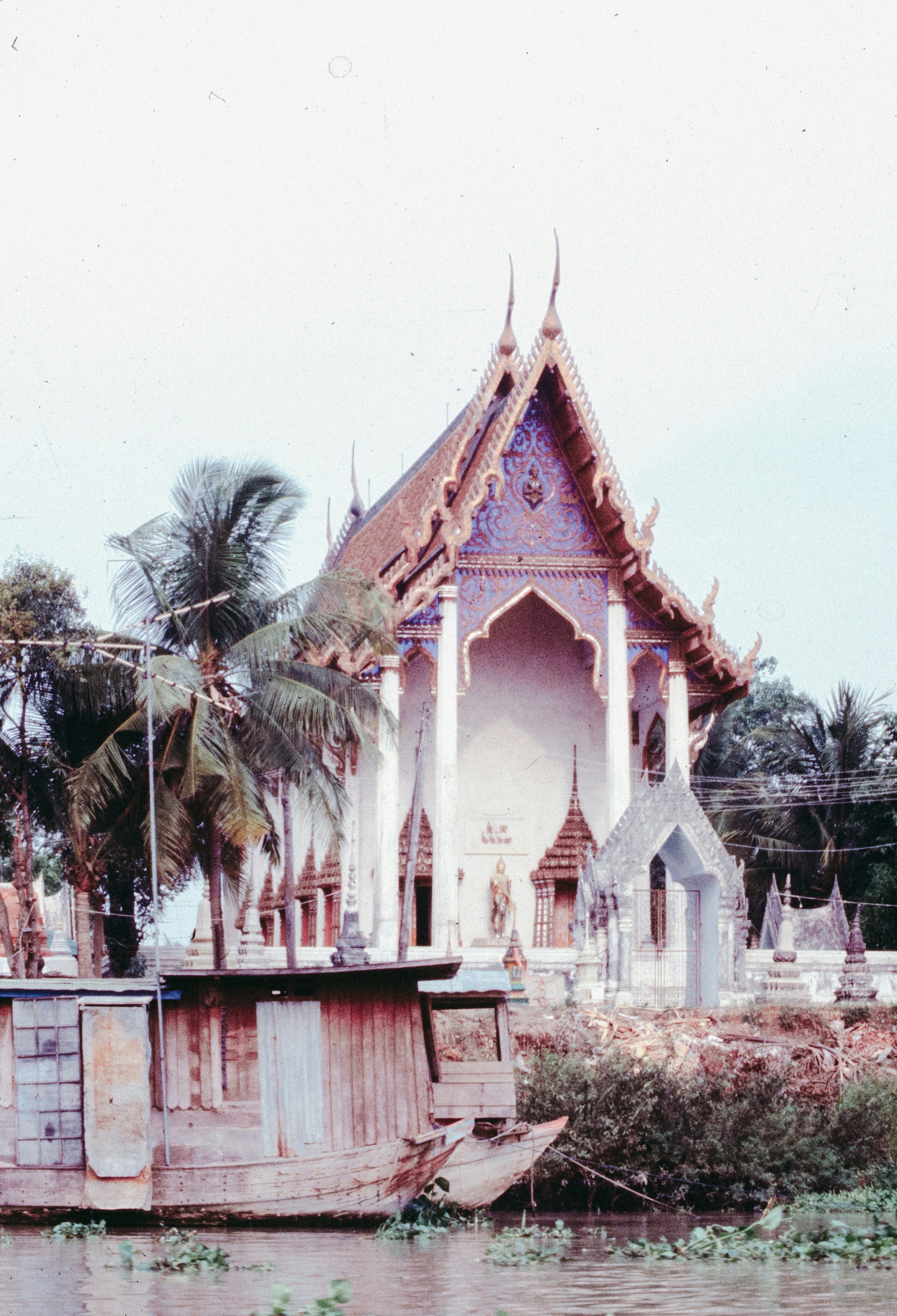 Temple building with boat on river
