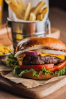 A juicy burger with cheese, lettuce, and tomato.