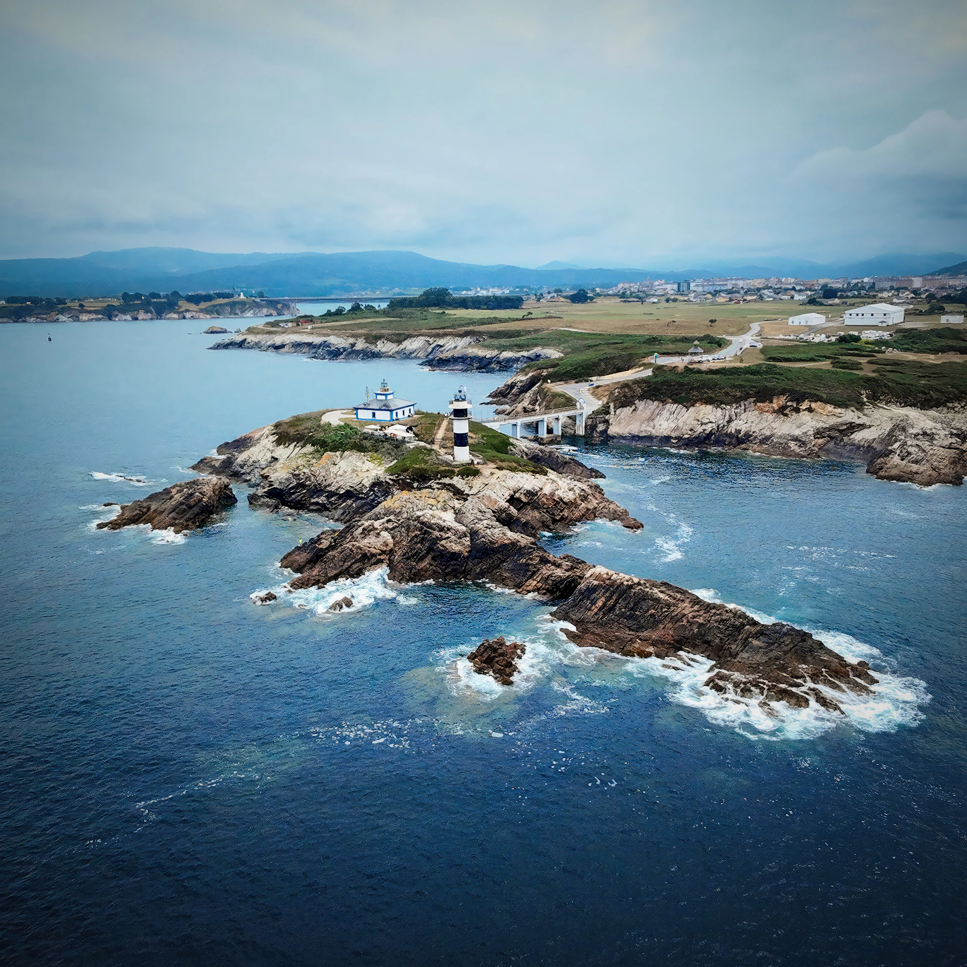 Lighthouse on a rocky island overlooking the ocean