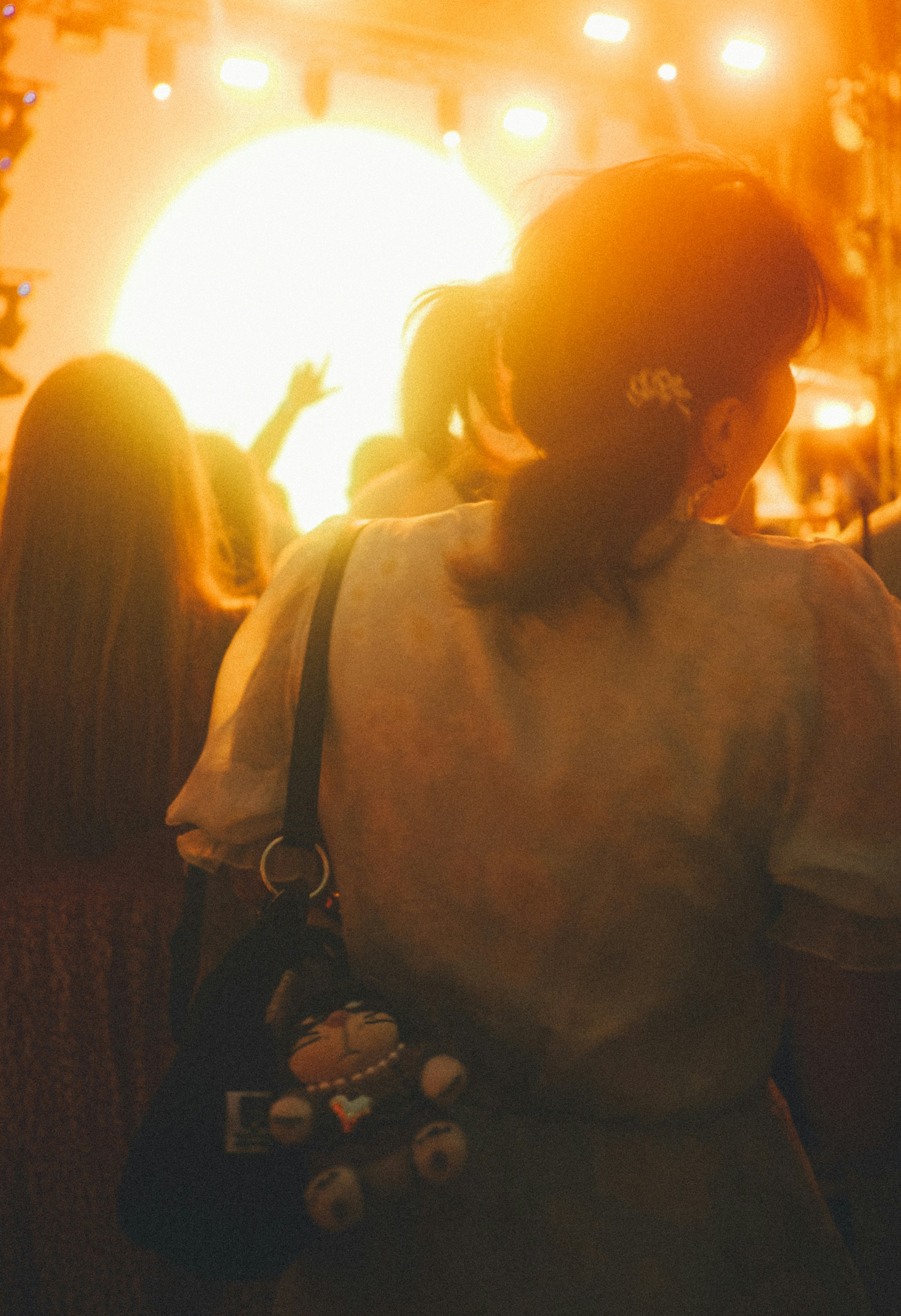 People watching a bright stage light show
