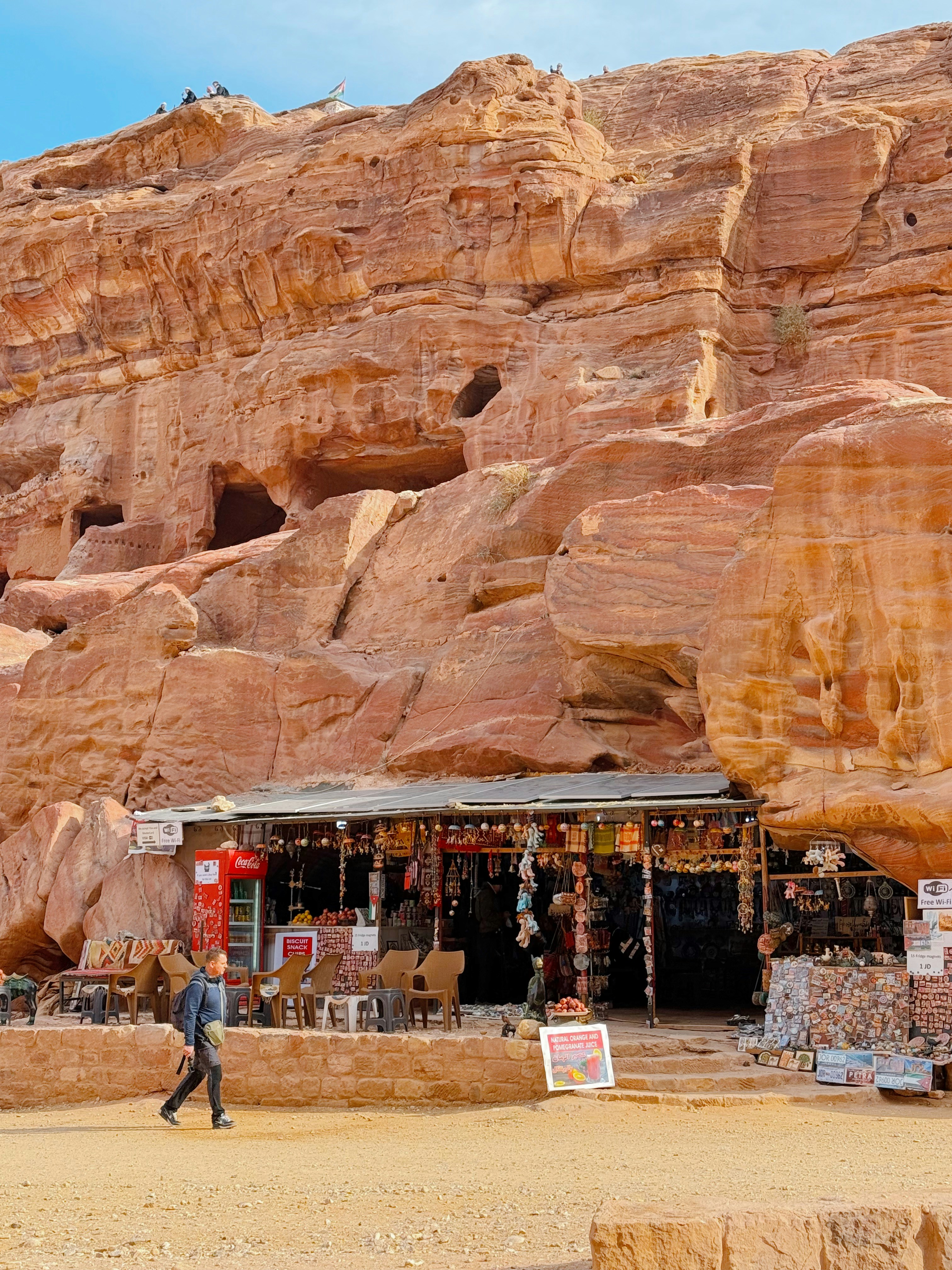 A small shop carved into a sandstone cliff