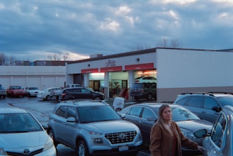 Cars parked in a lot outside a service center