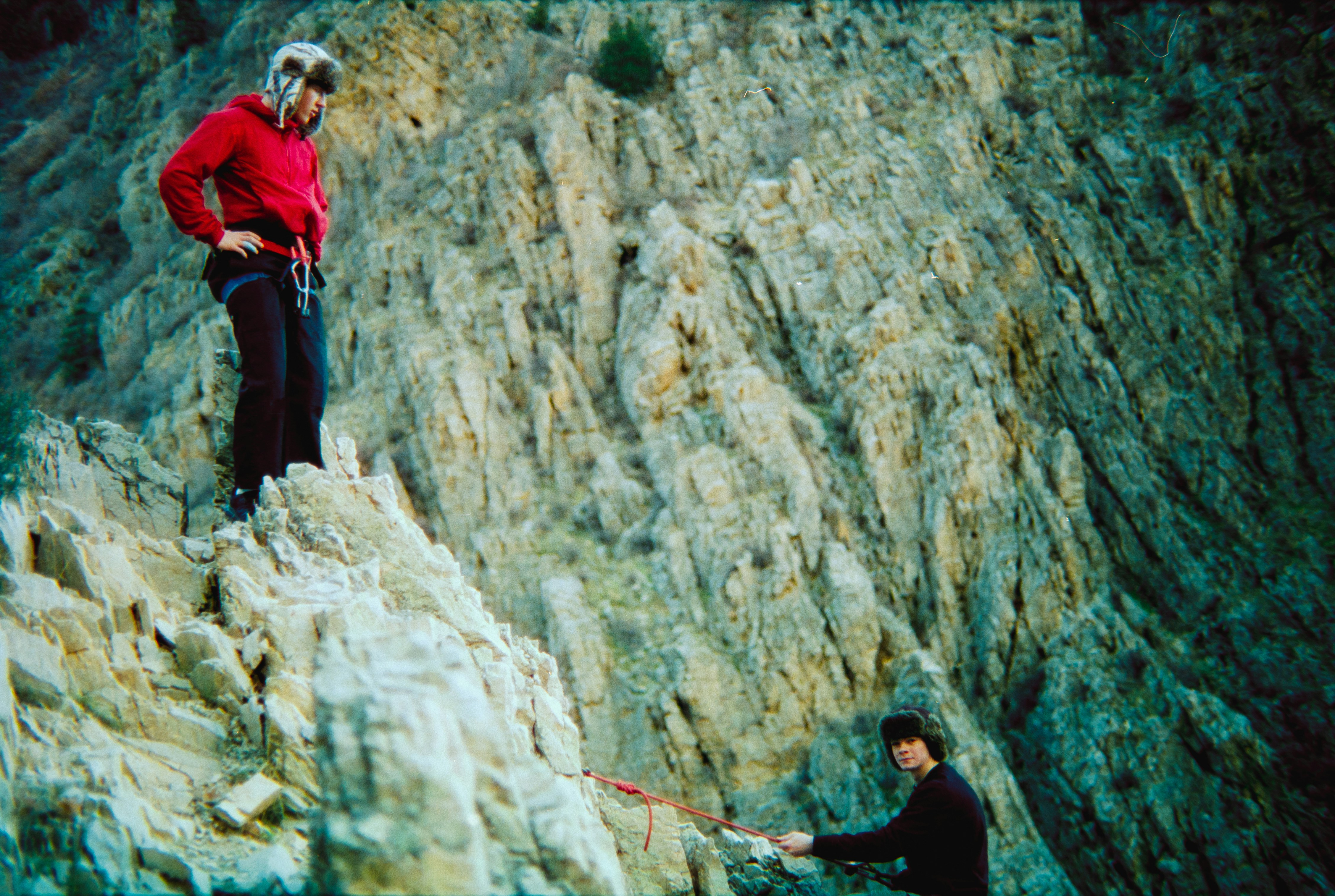 Two climbers on a rocky cliff face