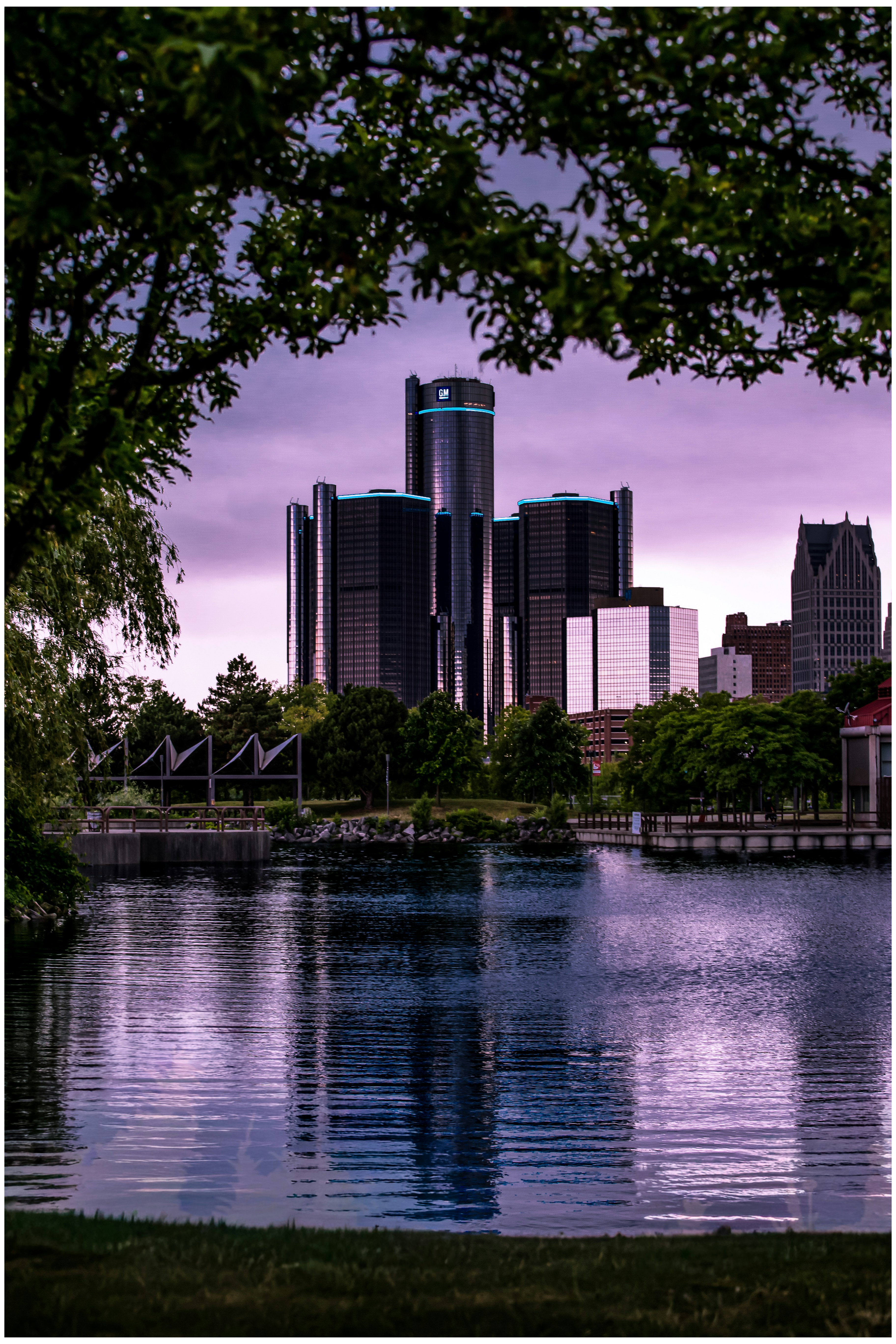 Detroit skyline reflected in the river at dusk