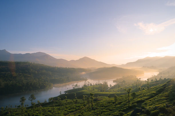 Misty mountains and a calm lake at sunrise