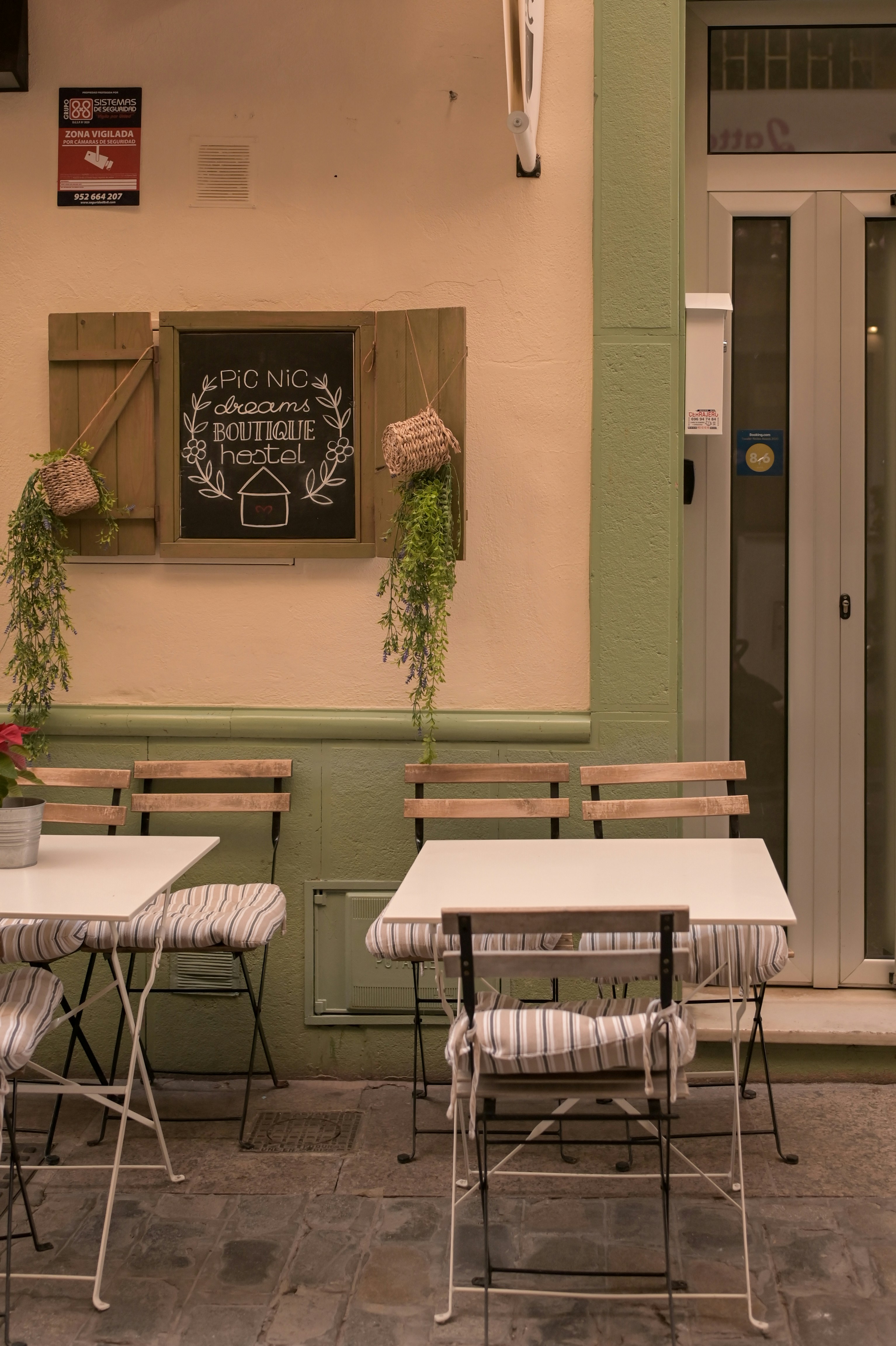 Outdoor cafe seating with tables and chairs