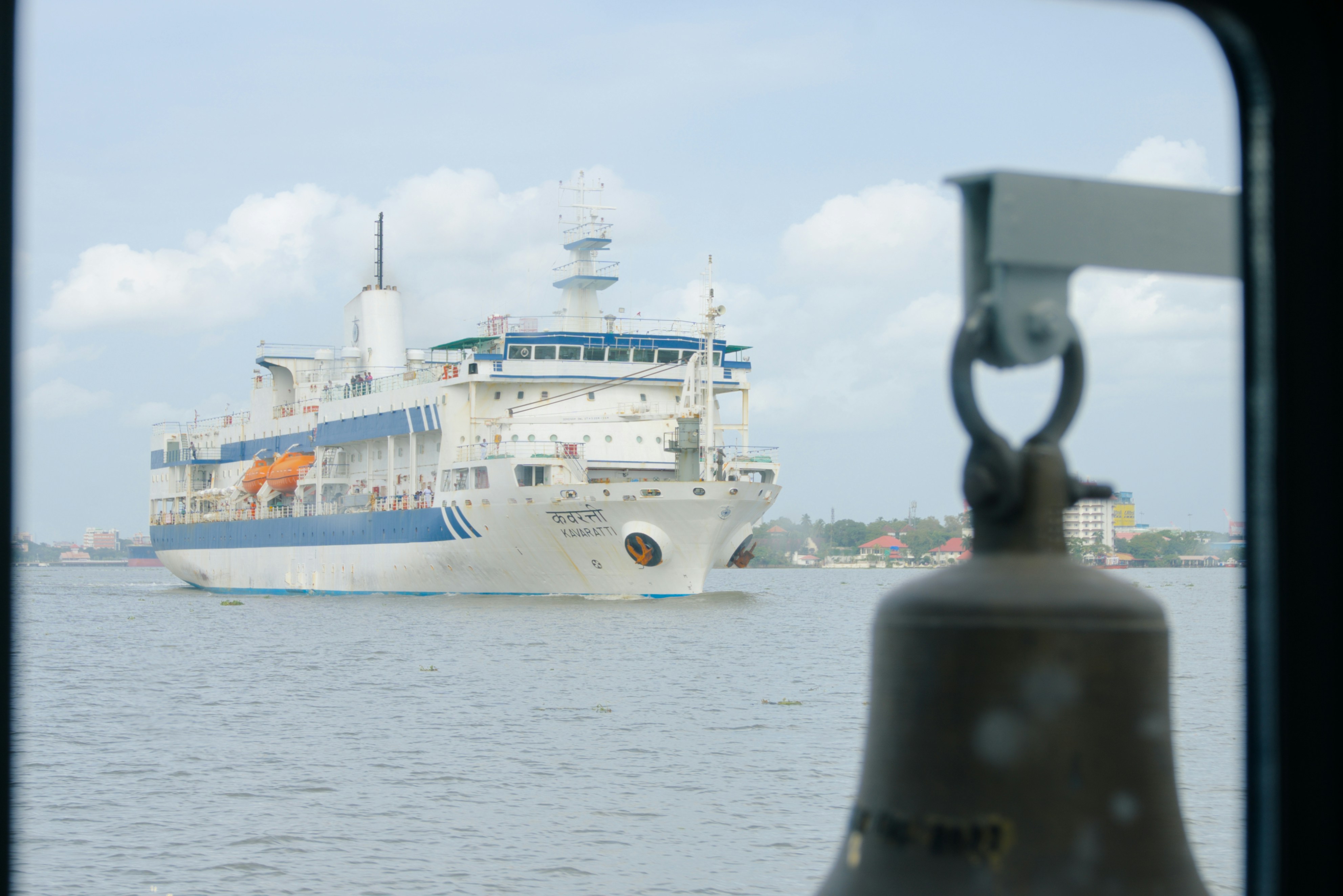 Large white ship sailing on the water.