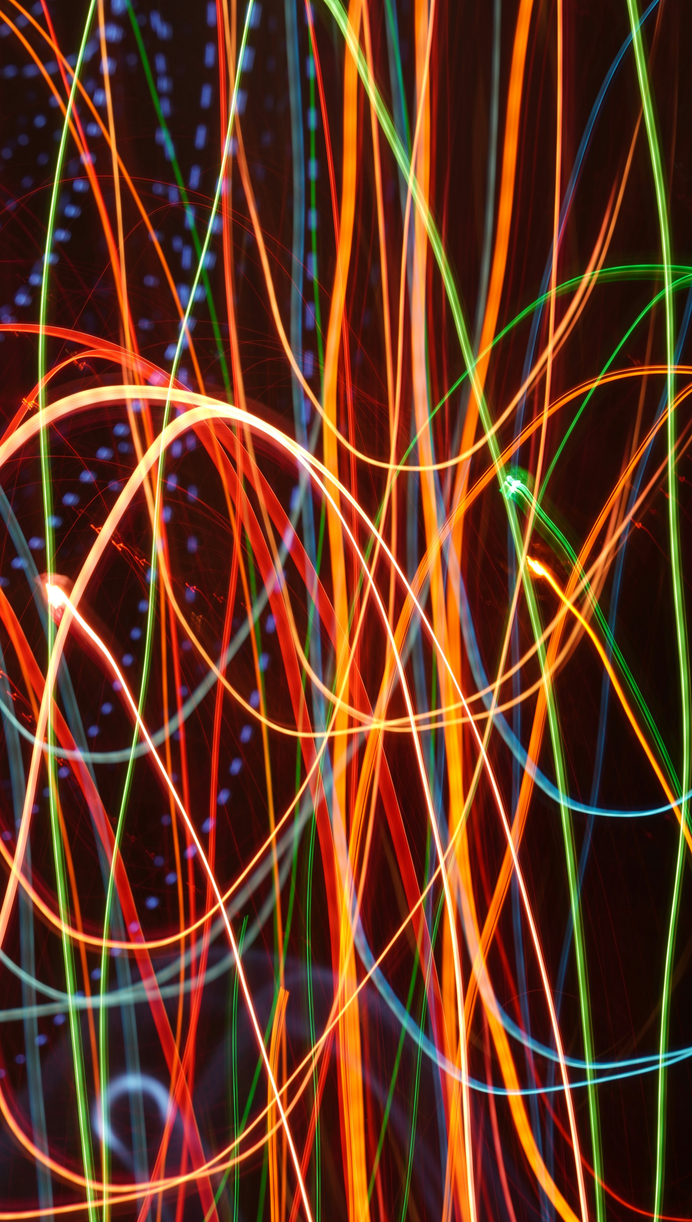 Colorful abstract light trails on dark