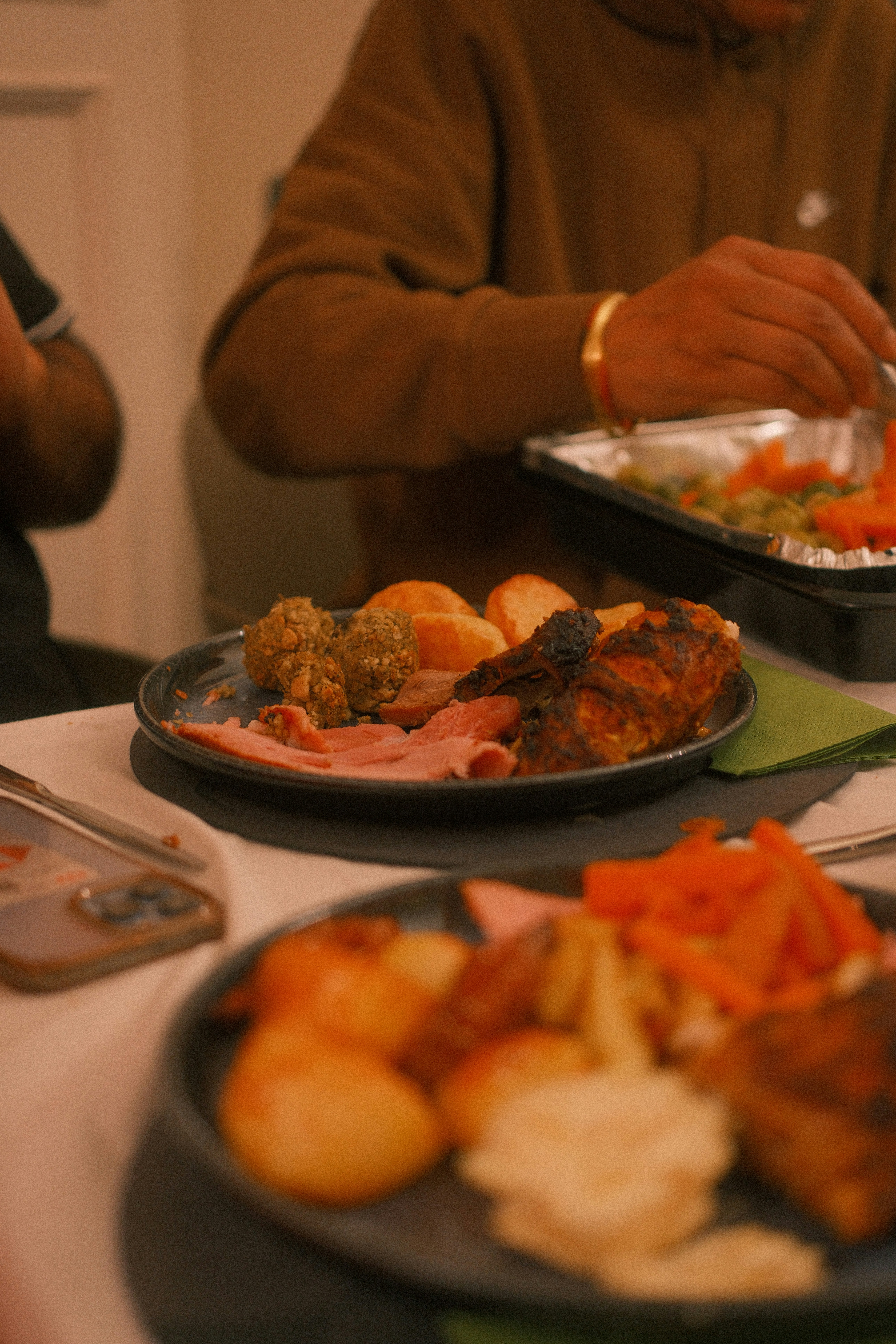 Plates of roasted meat and vegetables served vegetables