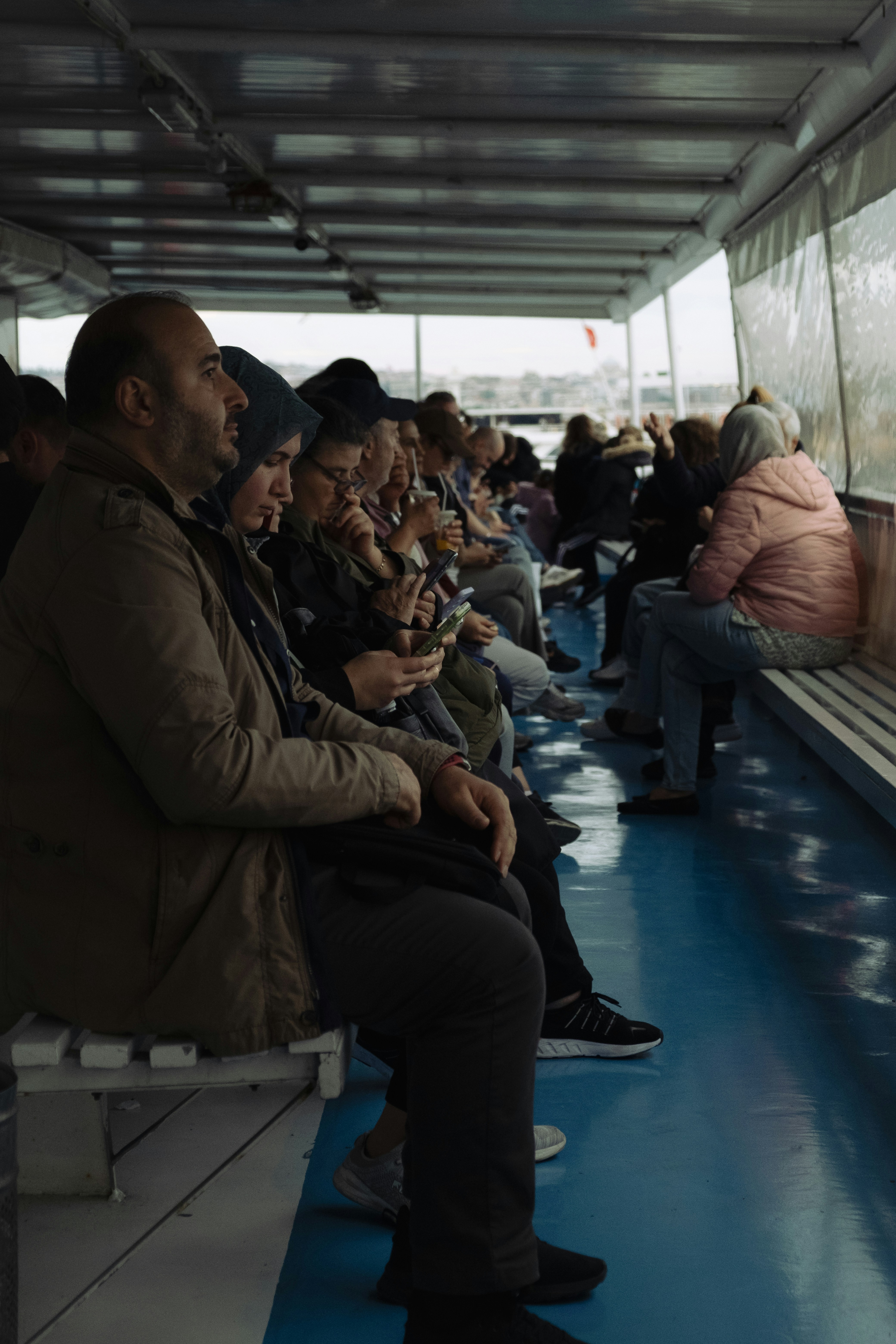 People sitting on a ferry looking forward