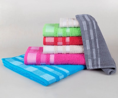 Stack of colorful folded towels on a white background