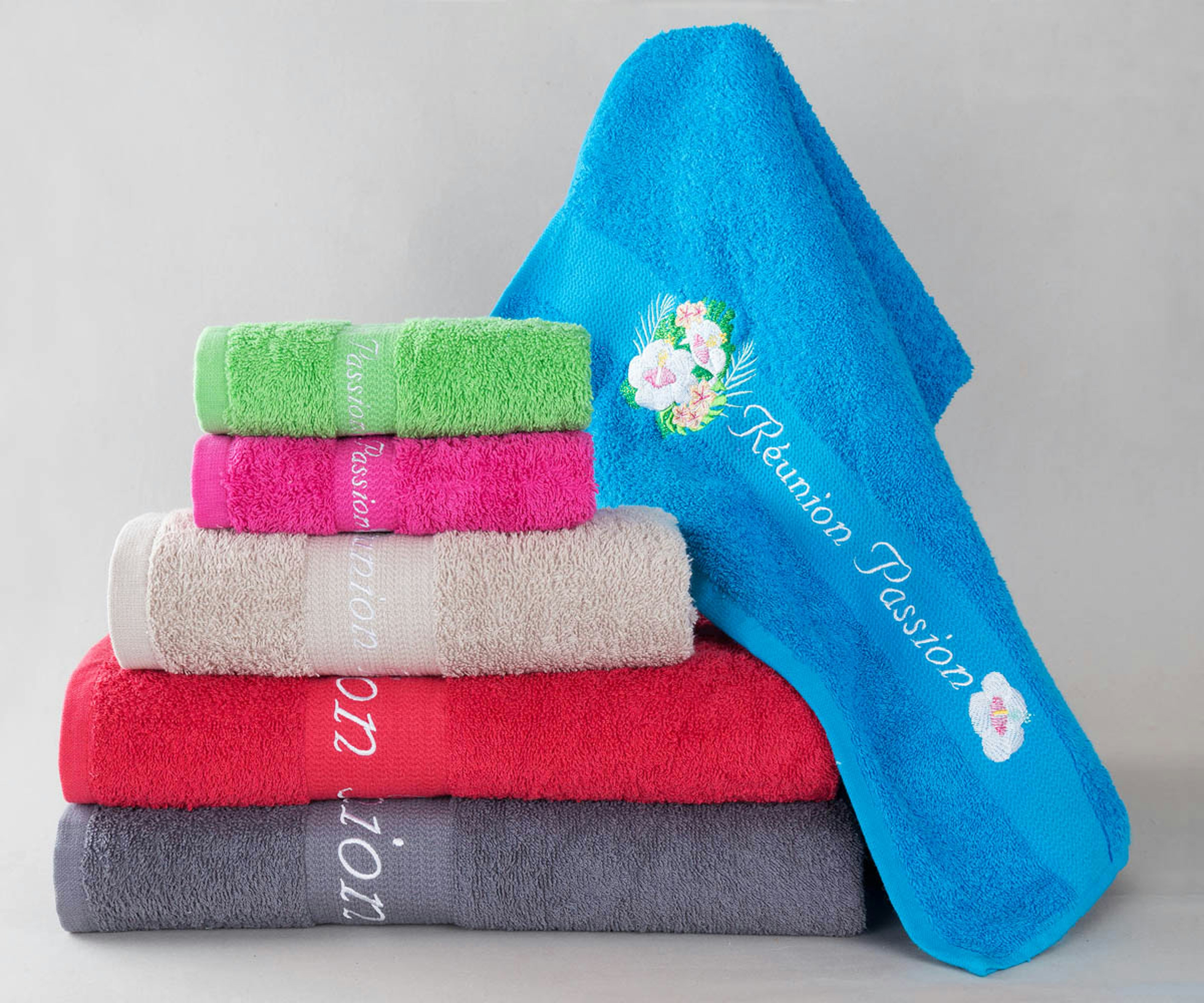 Stack of colorful towels with embroidery