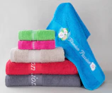 Stack of colorful towels with embroidery