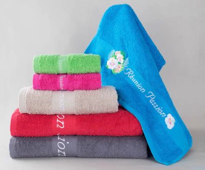 Stack of colorful towels with embroidery