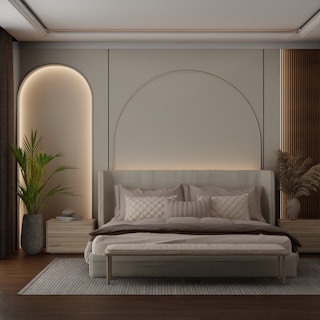 Modern bedroom with arched headboard and neutral decor.