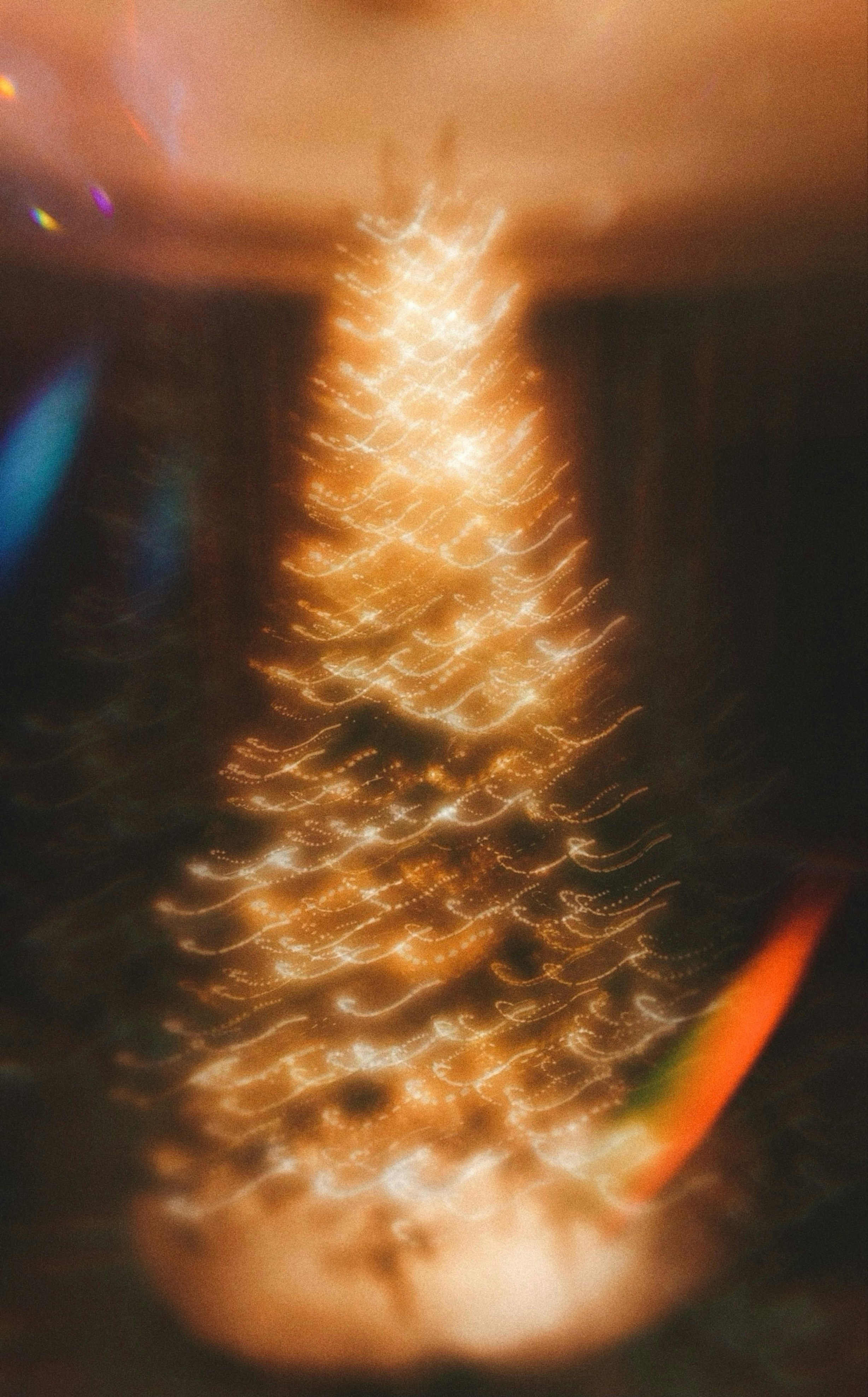 Abstract blurry christmas tree with warm glowing lights.