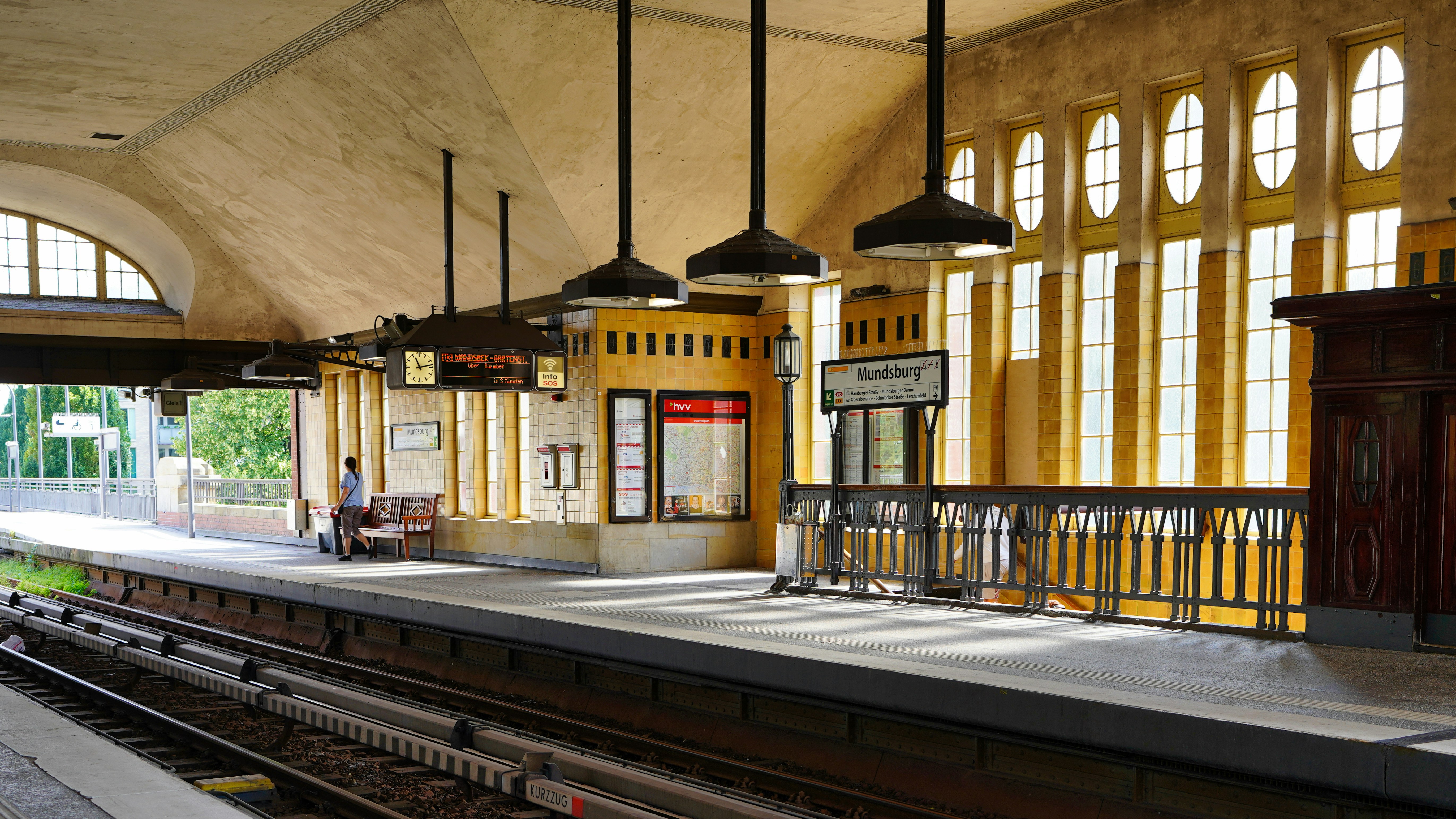 Empty train station platform with arched windows