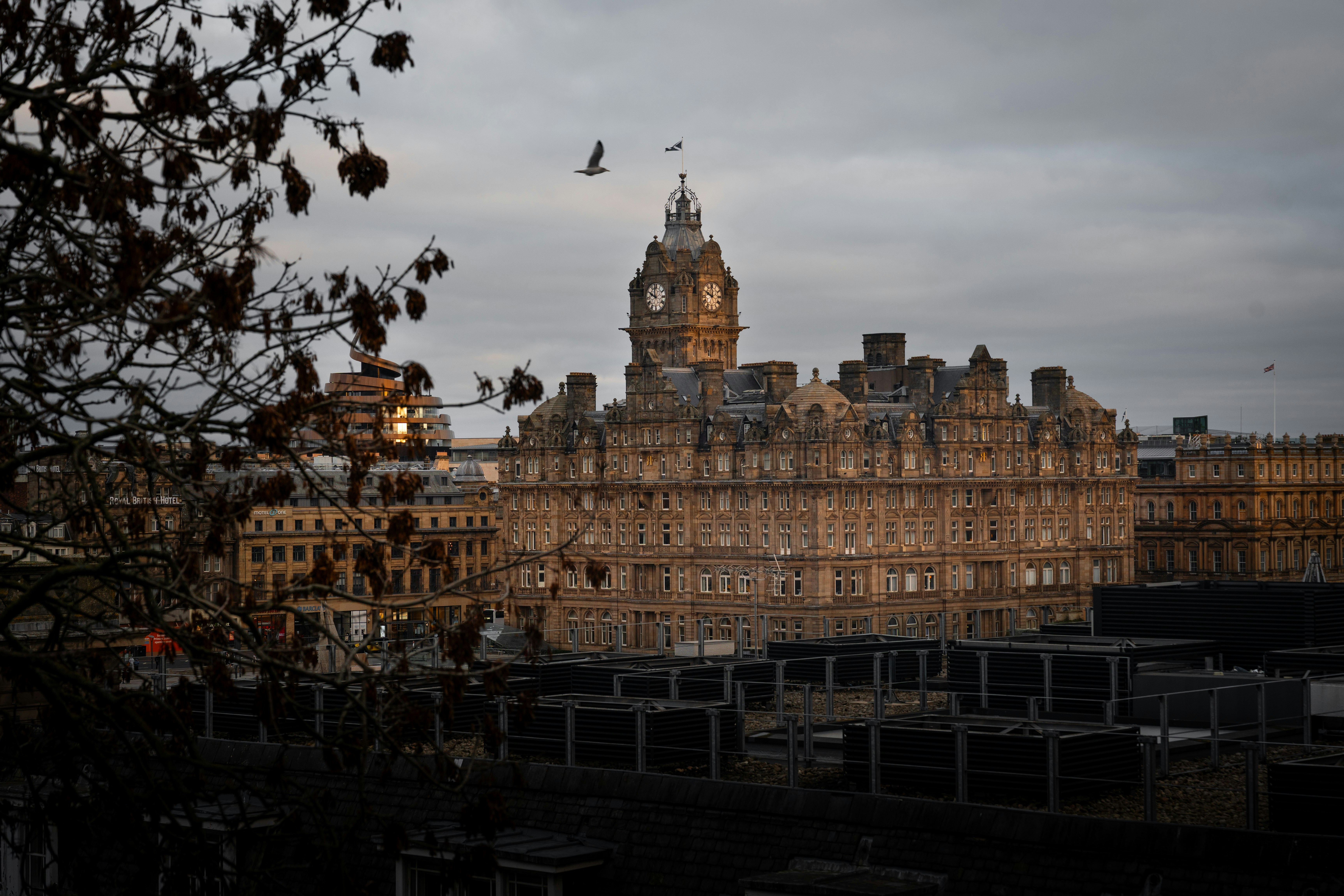 Historic building with a clock tower at dusk.