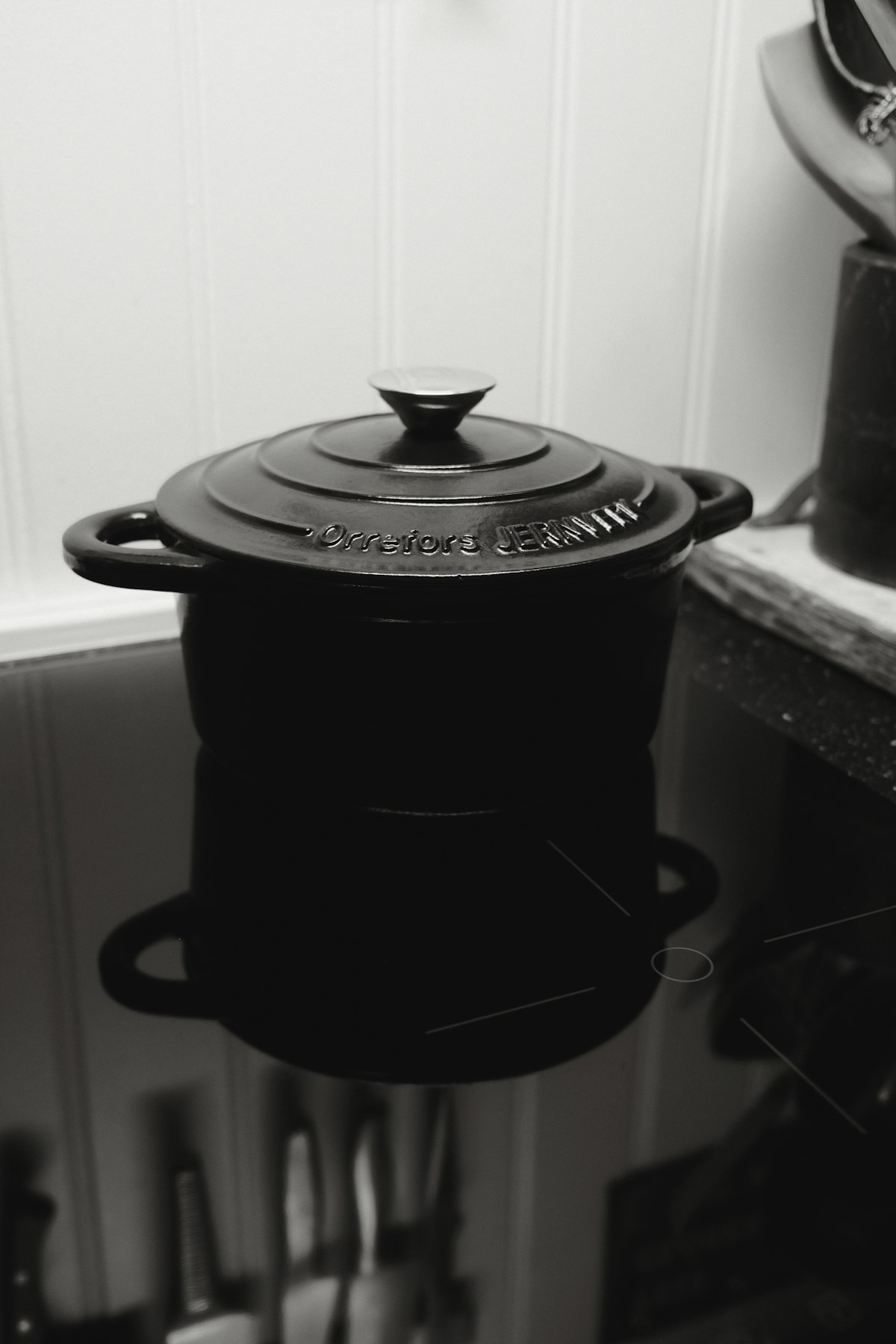 Cast iron pot with lid on a stovetop