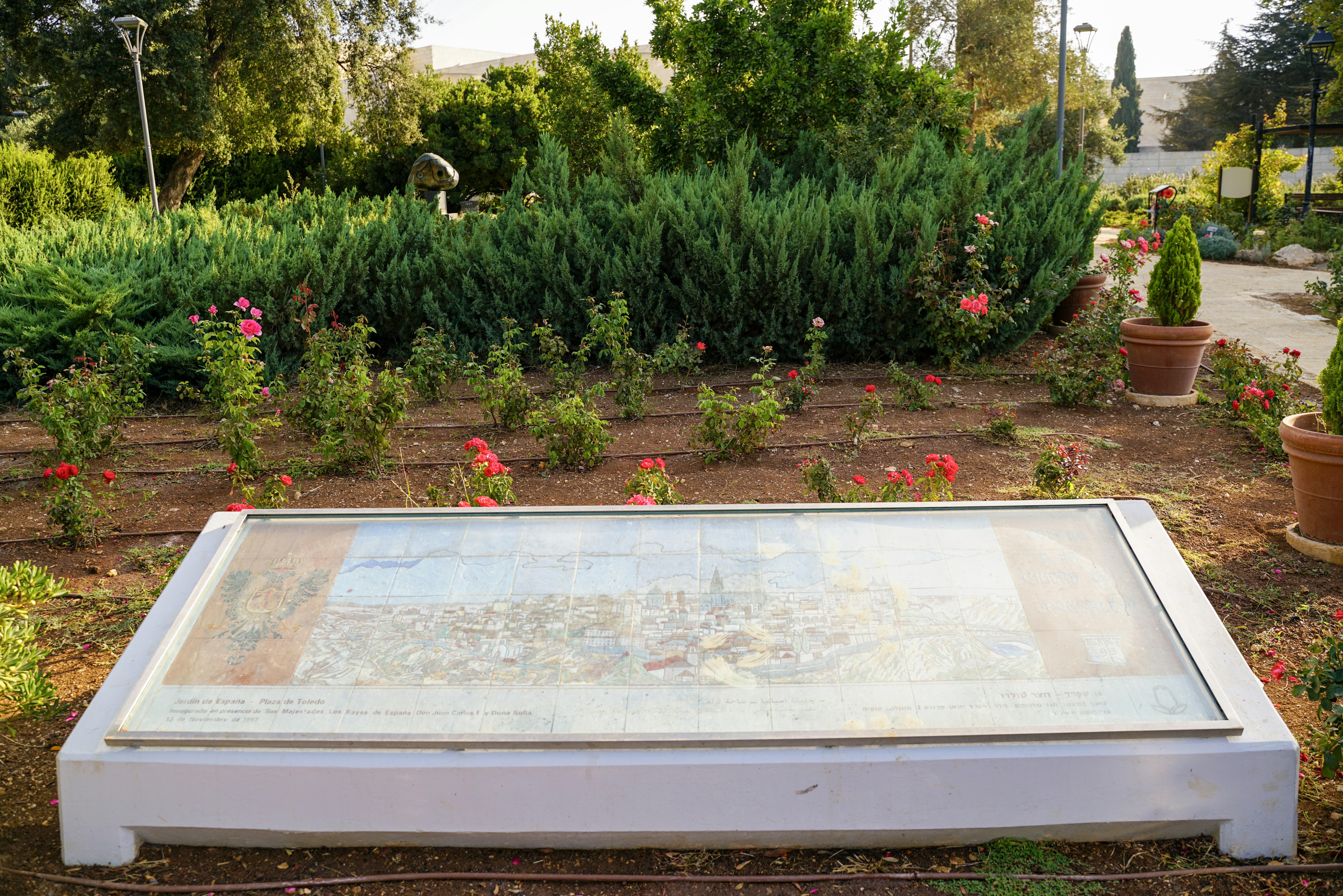 Informational display in a lush garden setting.