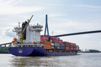 A large cargo ship carrying containers on the water.