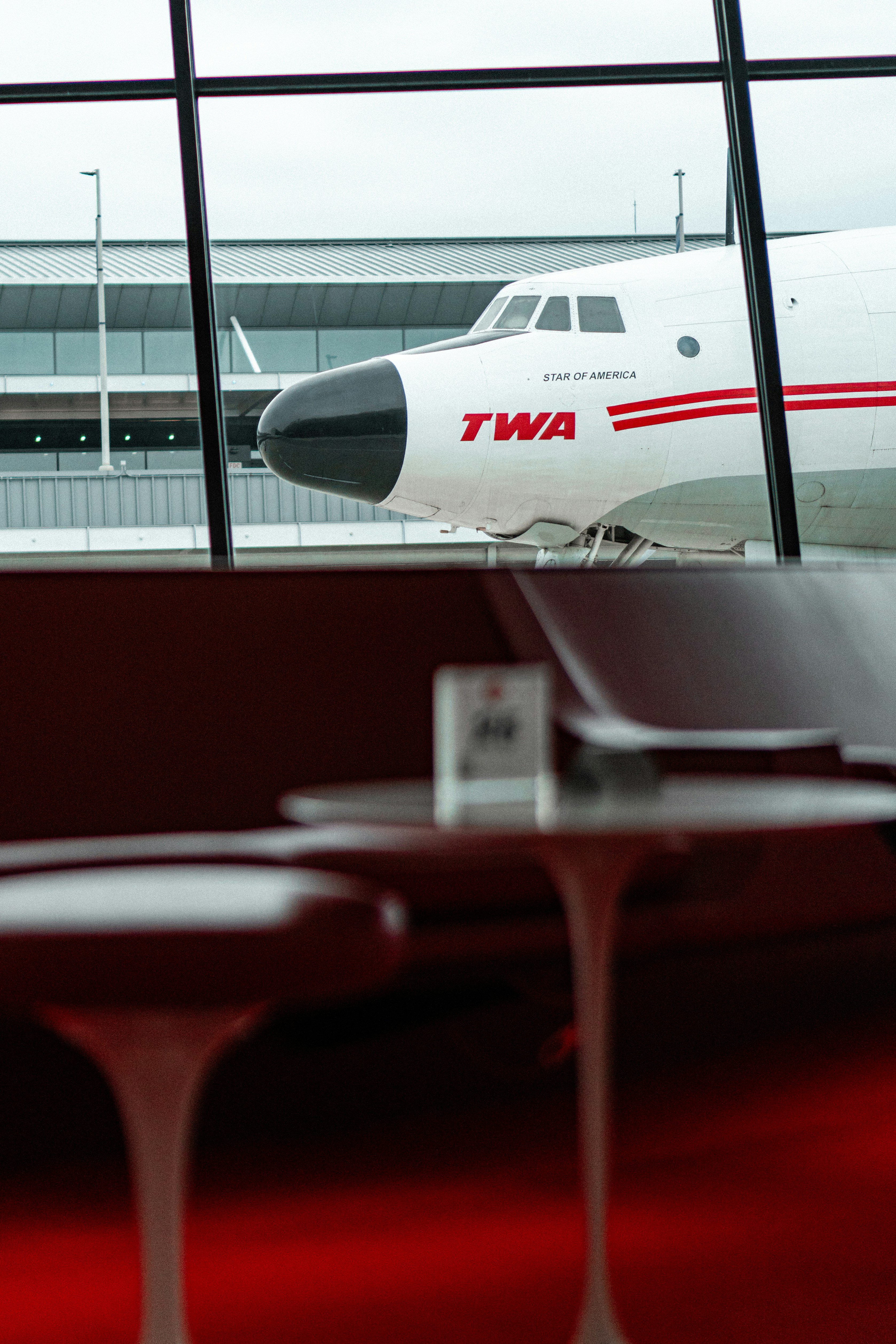 Twa airplane seen through airport window