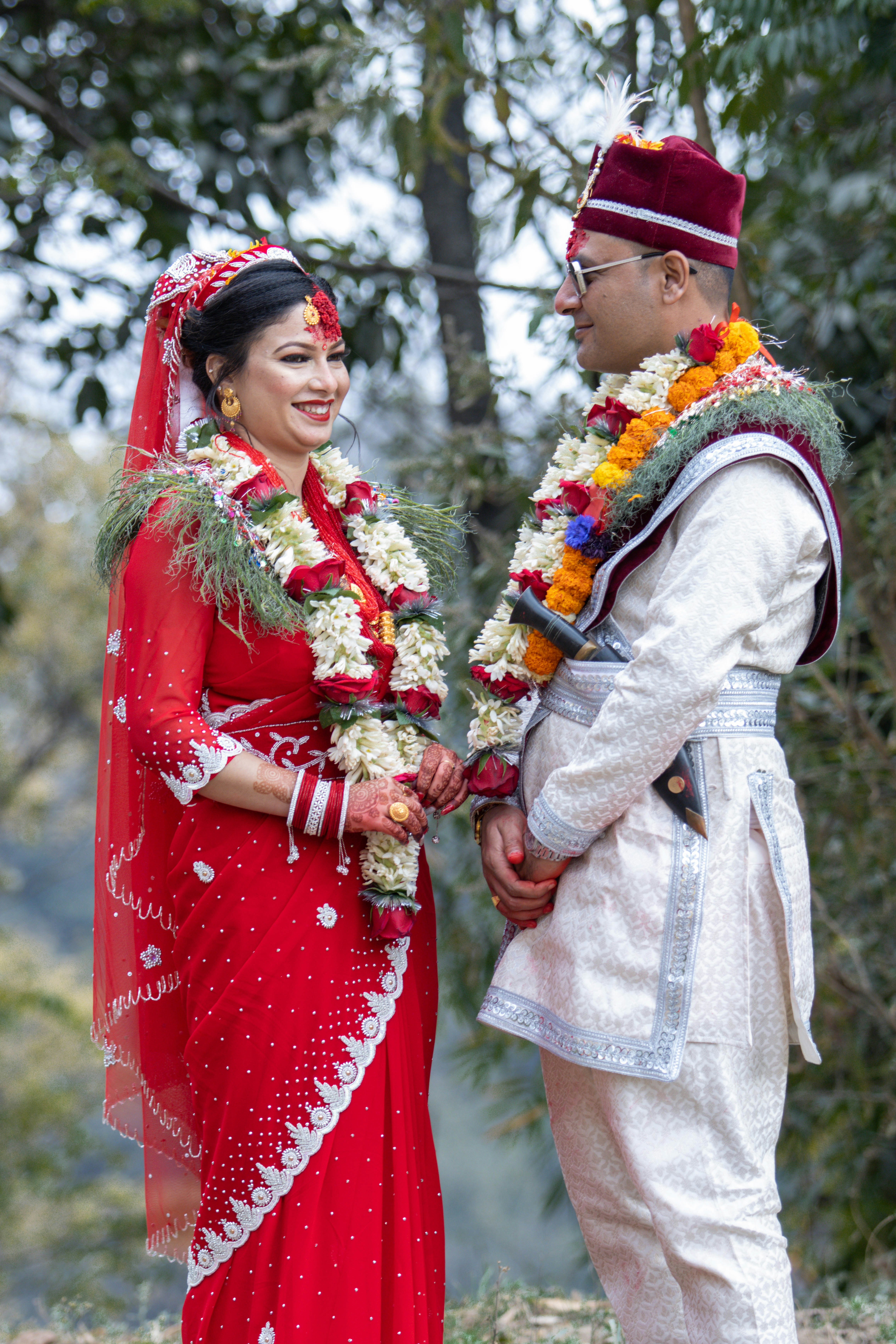A bride and groom in traditional wedding attire