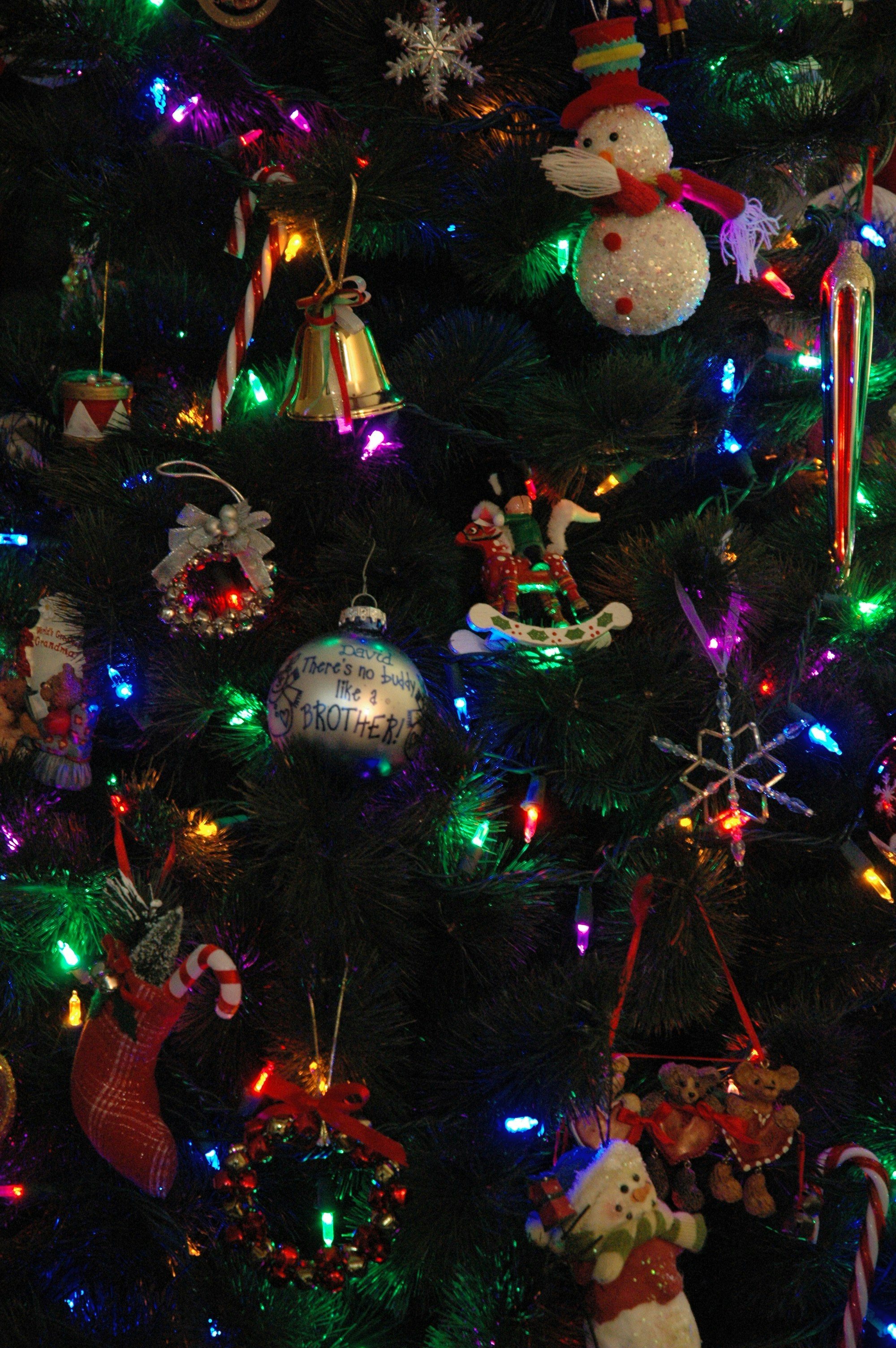 A decorated christmas tree with colorful lights and ornaments.