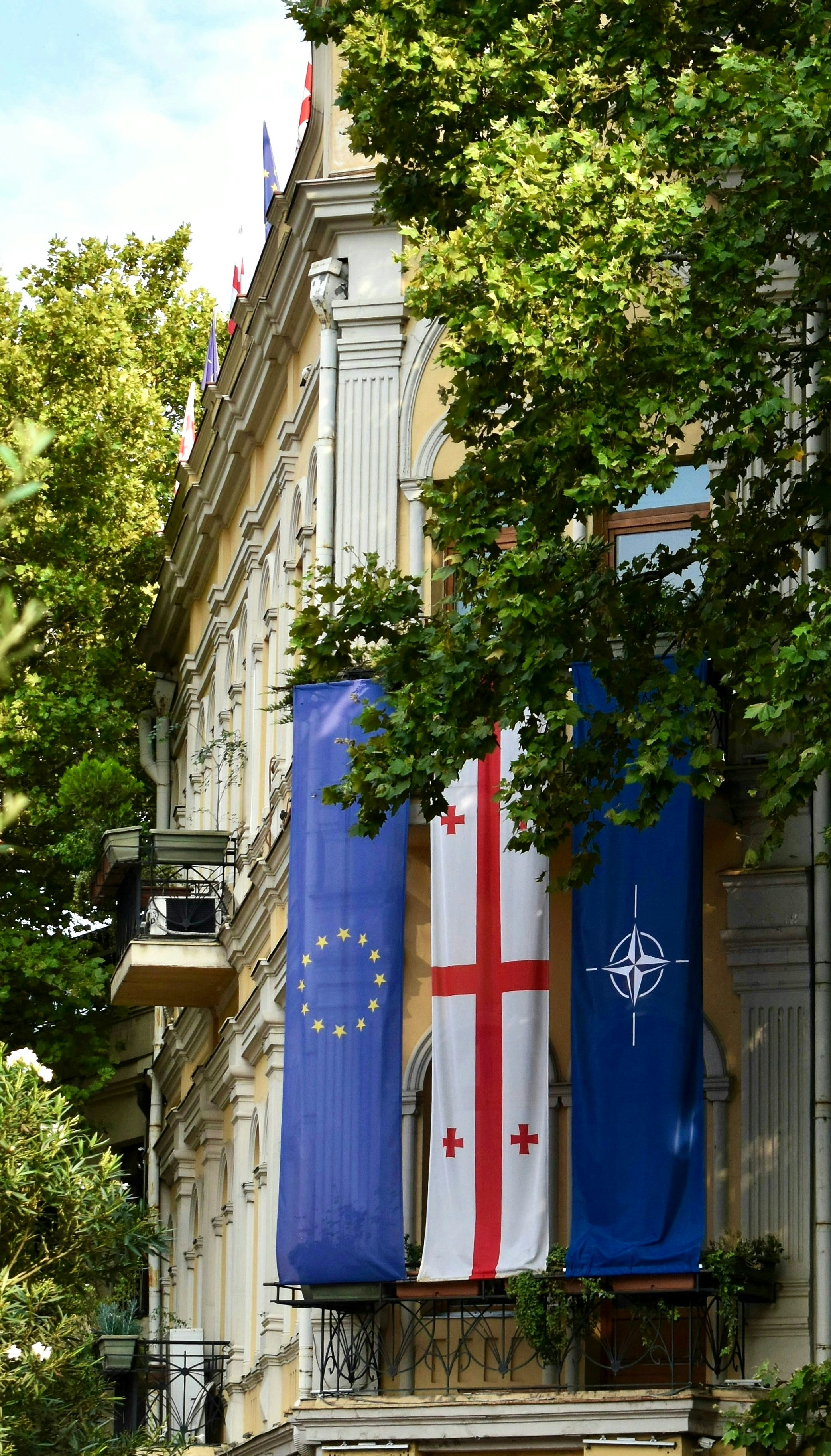 European union, georgia, and nato flags displayed