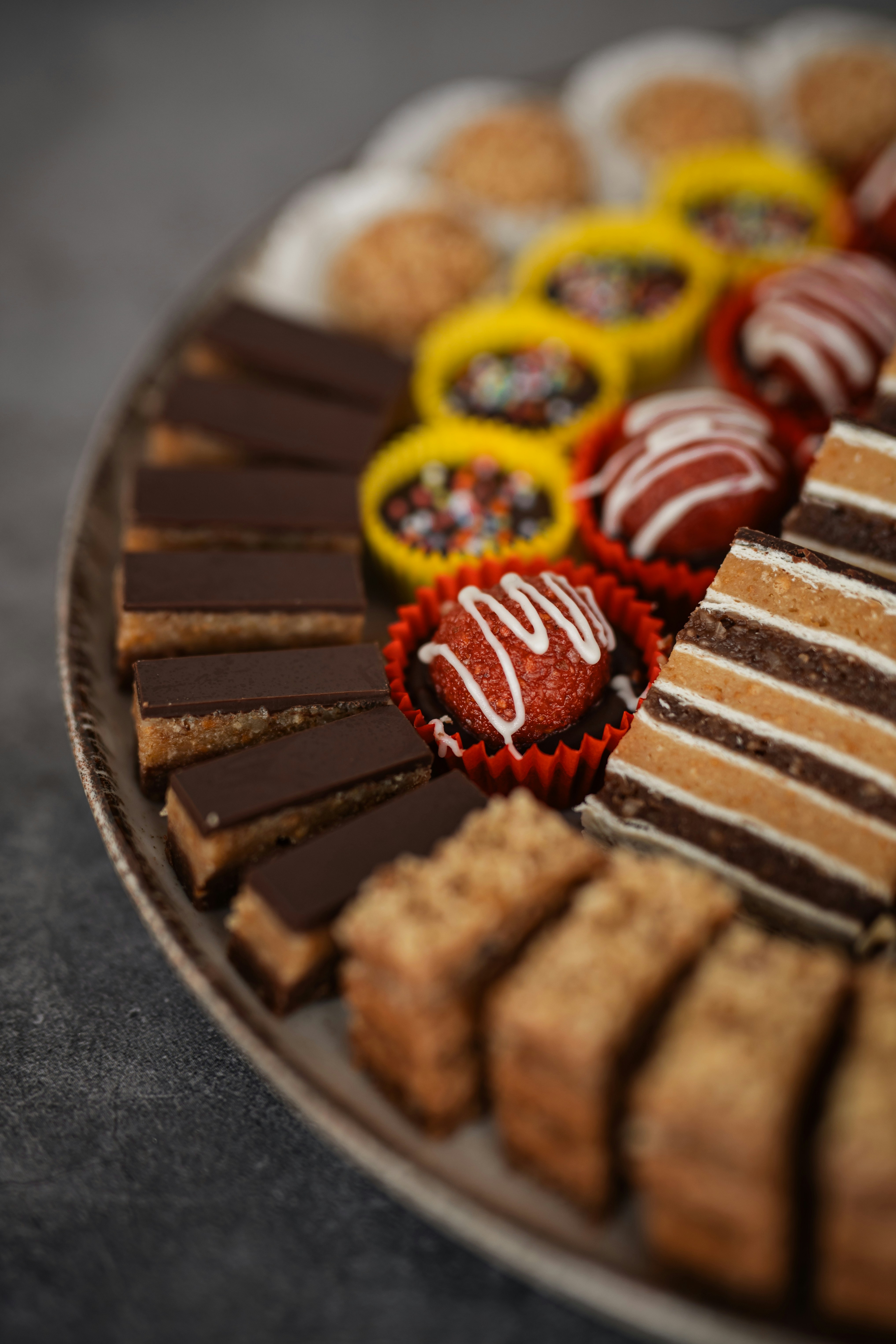 Assortment of delicious cookies and pastries on a platter.