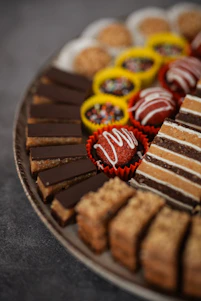 Assortment of delicious cookies and pastries on a platter.