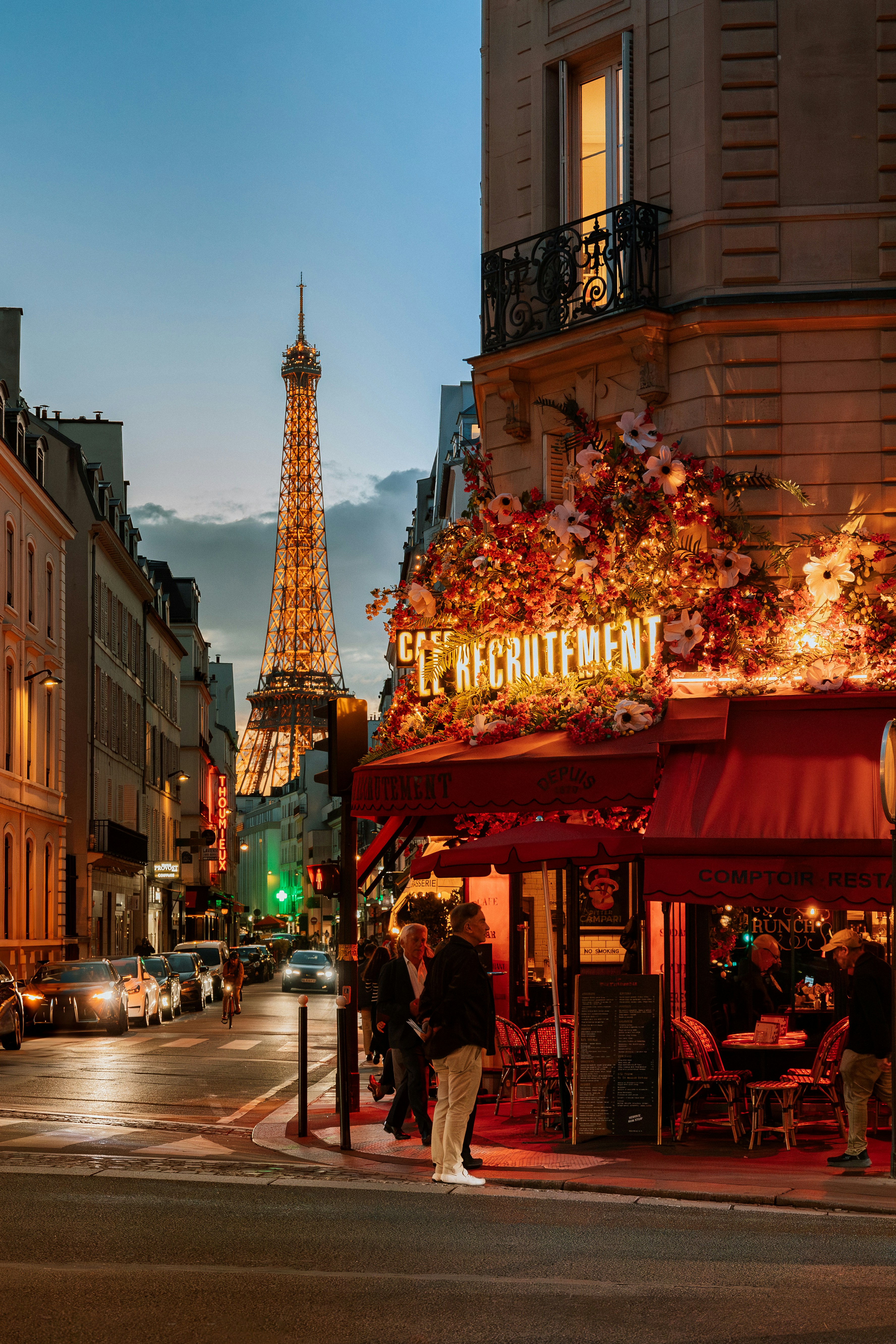 Eiffel tower view from a parisian street cafe.
