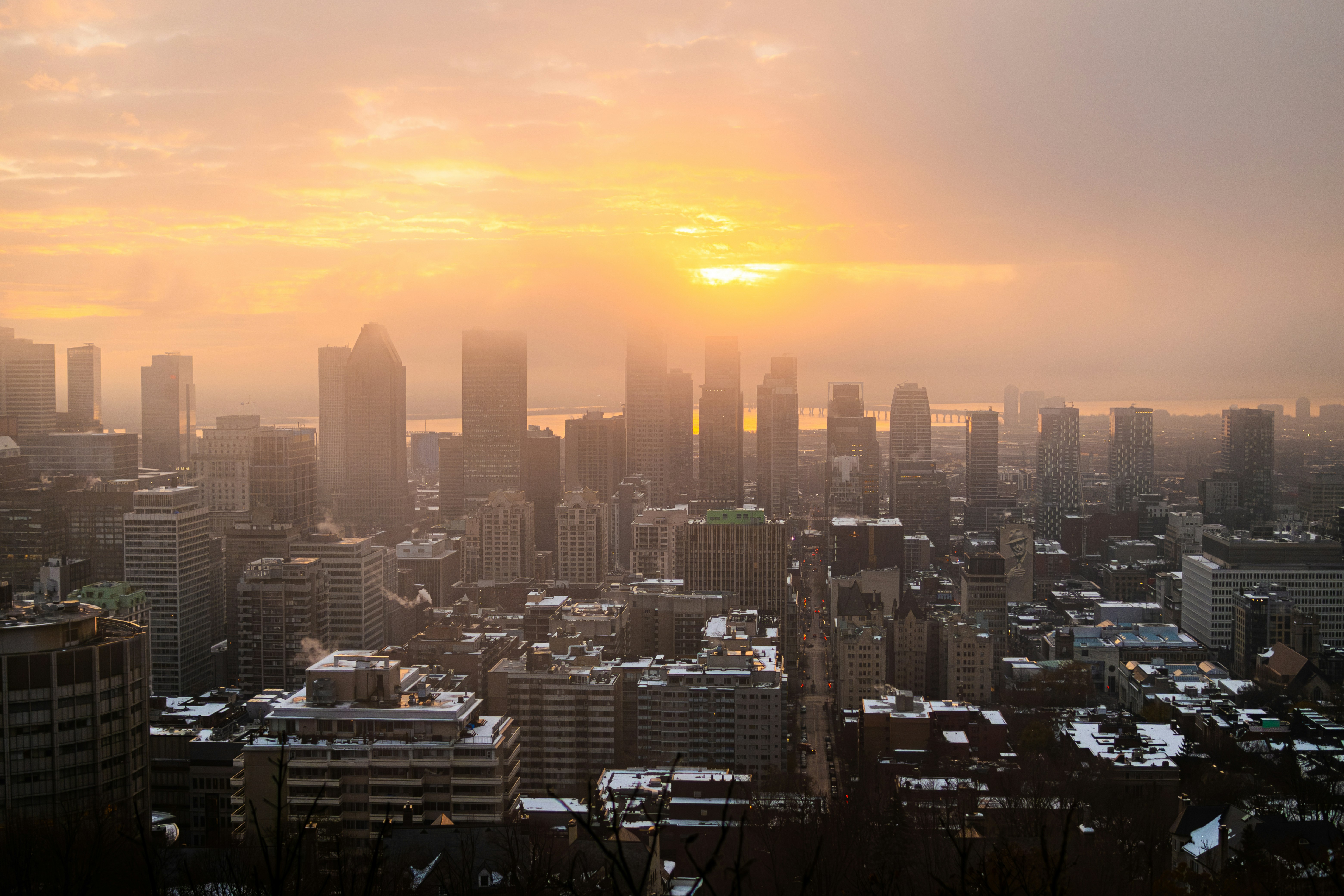 City skyline at sunrise with hazy sky