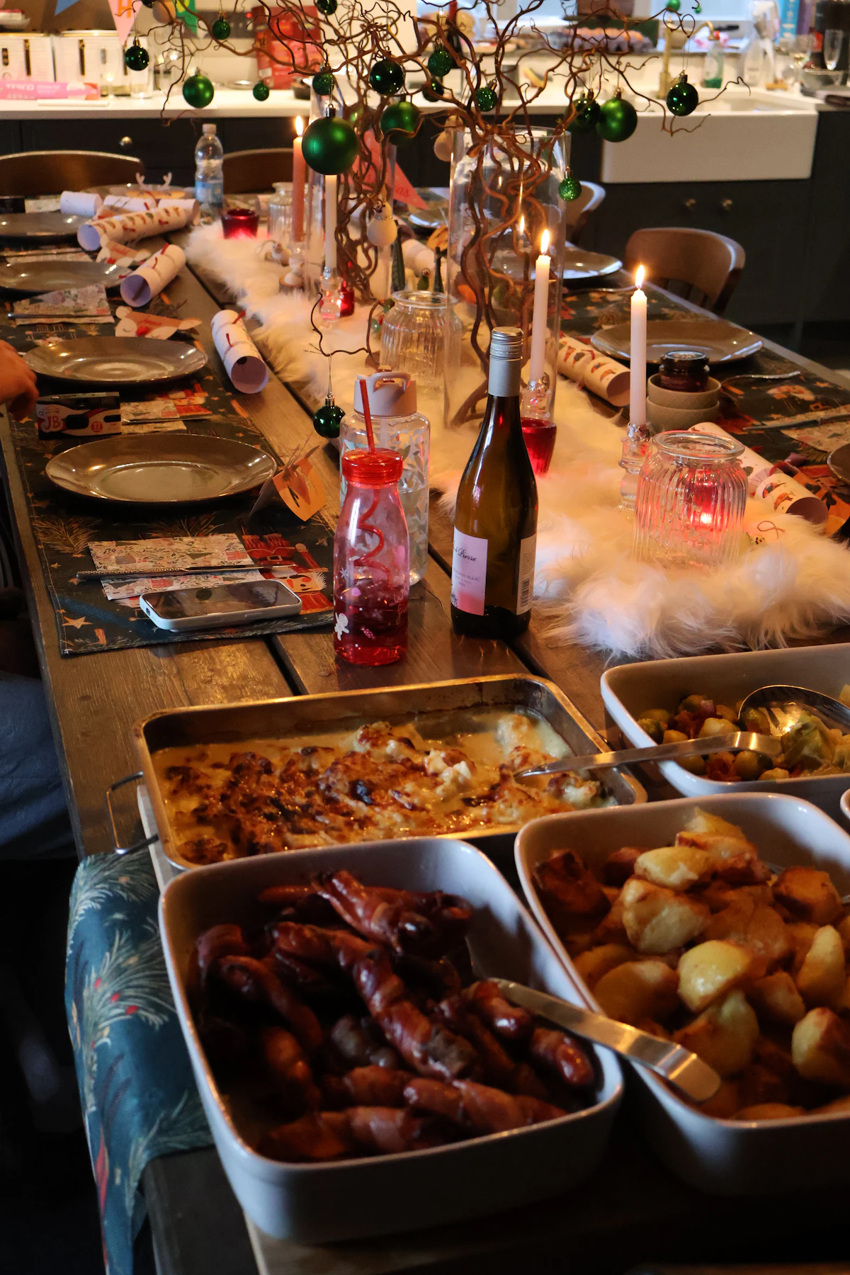 Christmas dinner table with roasted meats and vegetables