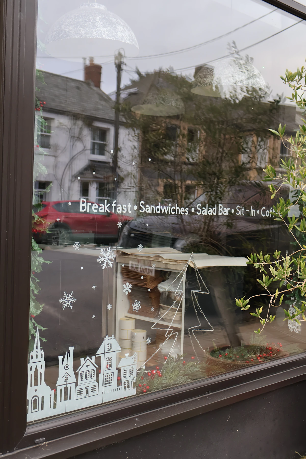 Window display of pastries and menu items