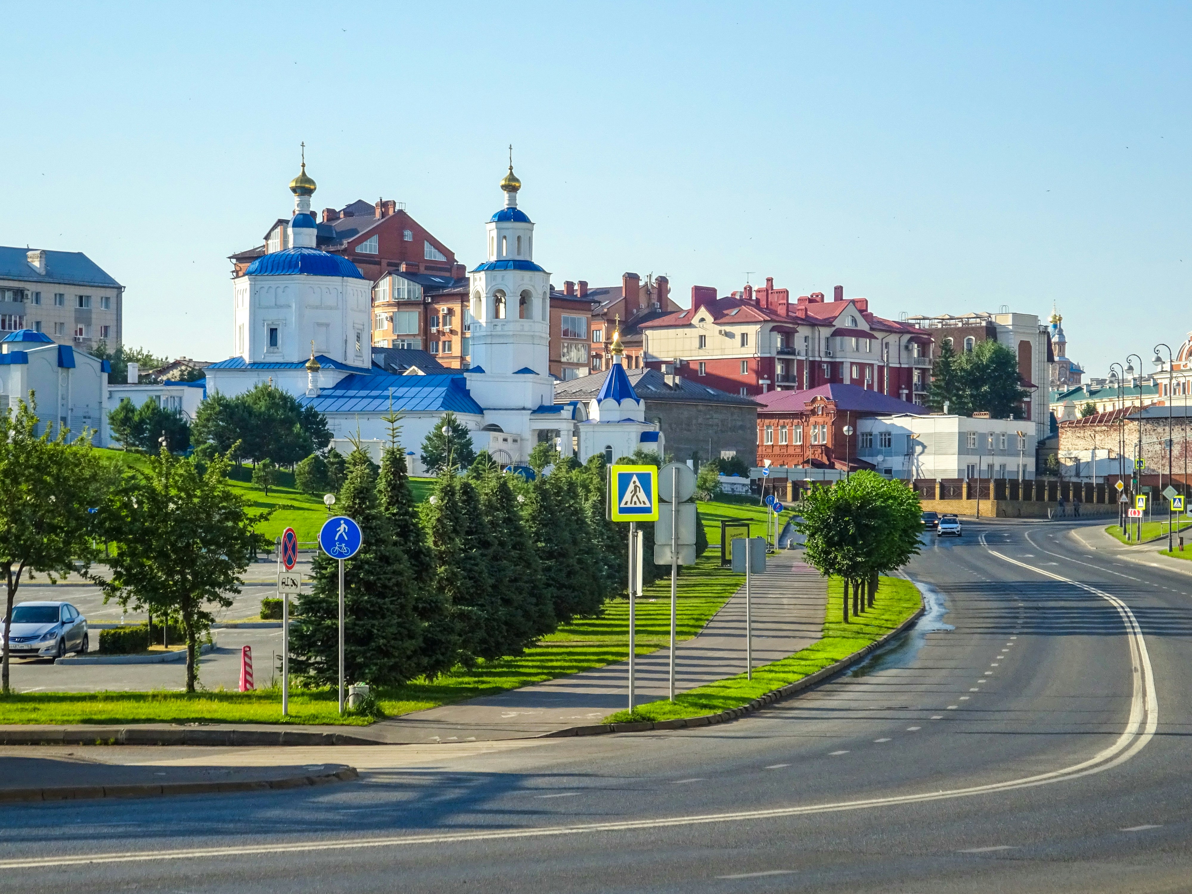 Cityscape with a white church and colorful buildings