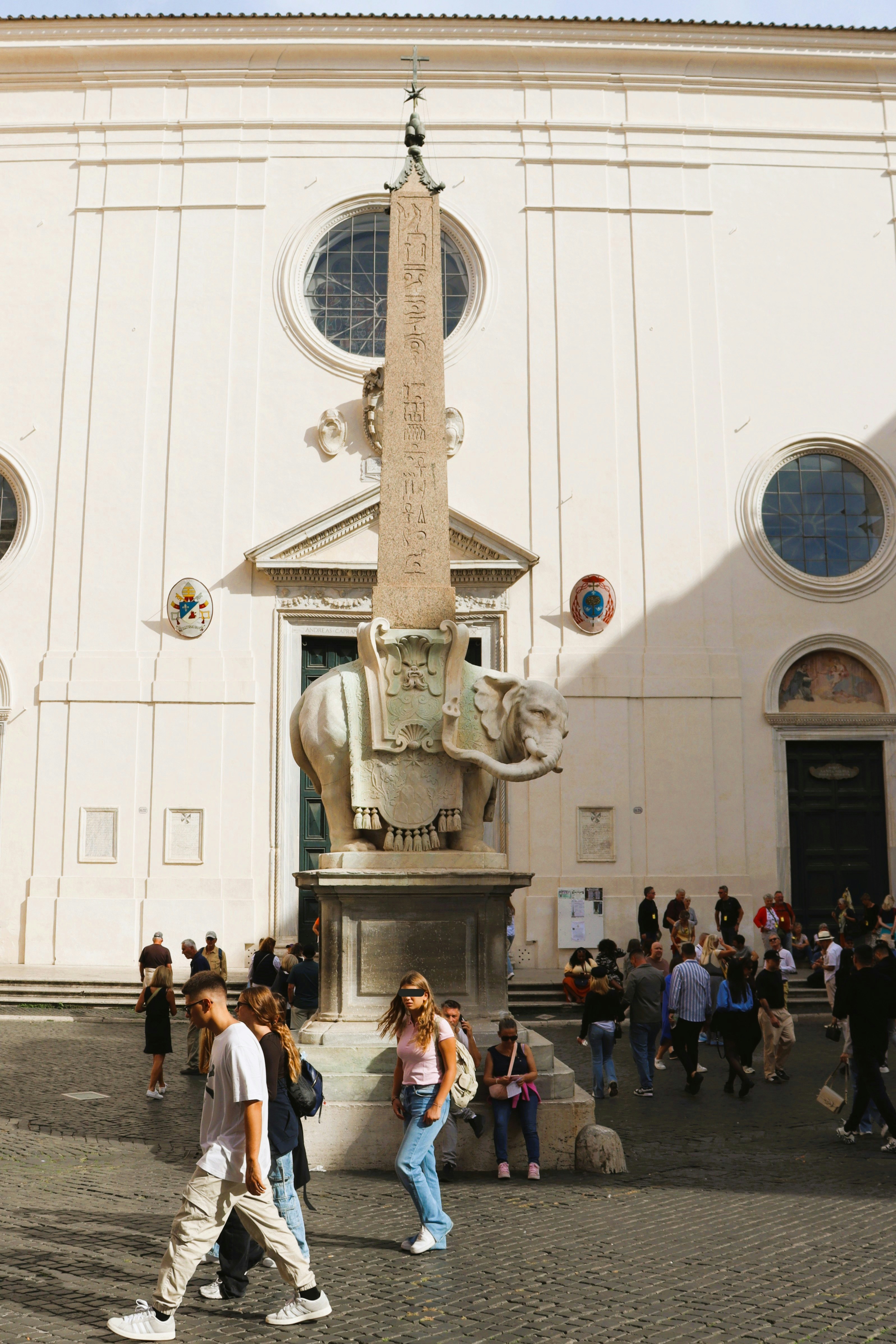 Elephant statue with obelisk in front of building
