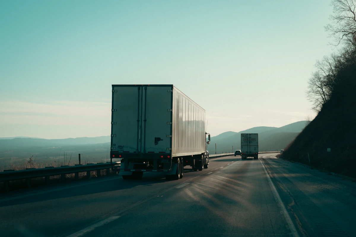 Trucks on a highway in the mountains