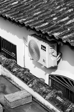 Air conditioning unit mounted on a white wall.